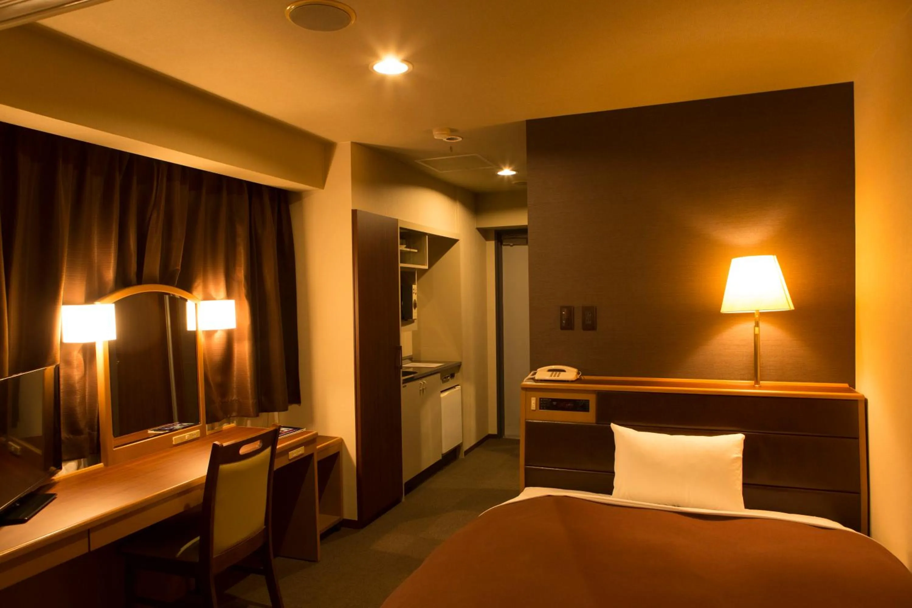 Communal lounge/ TV room, Bed in Nisshin Namba Inn