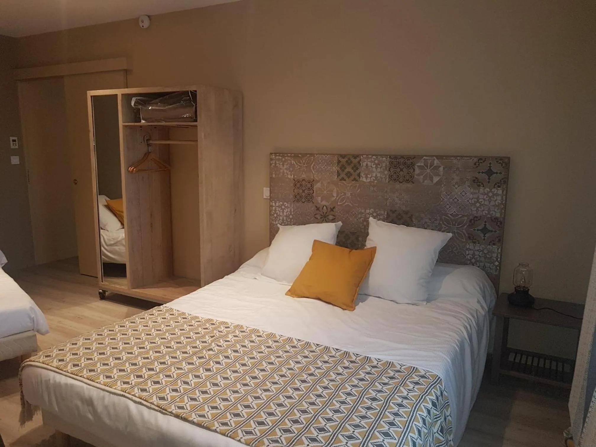 Bed in Logis Hôtel Terre de Loire