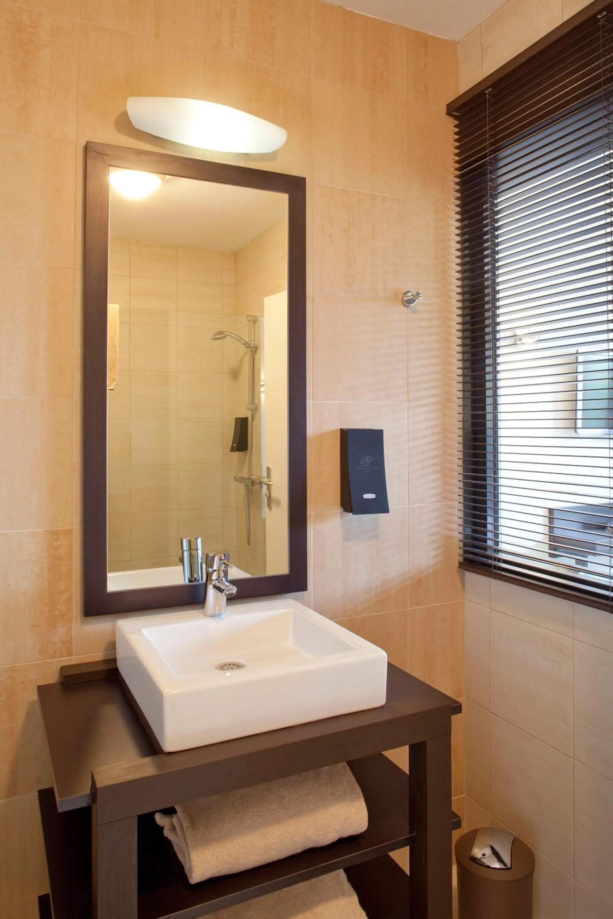 Bathroom in Logis Hôtel Terre de Loire