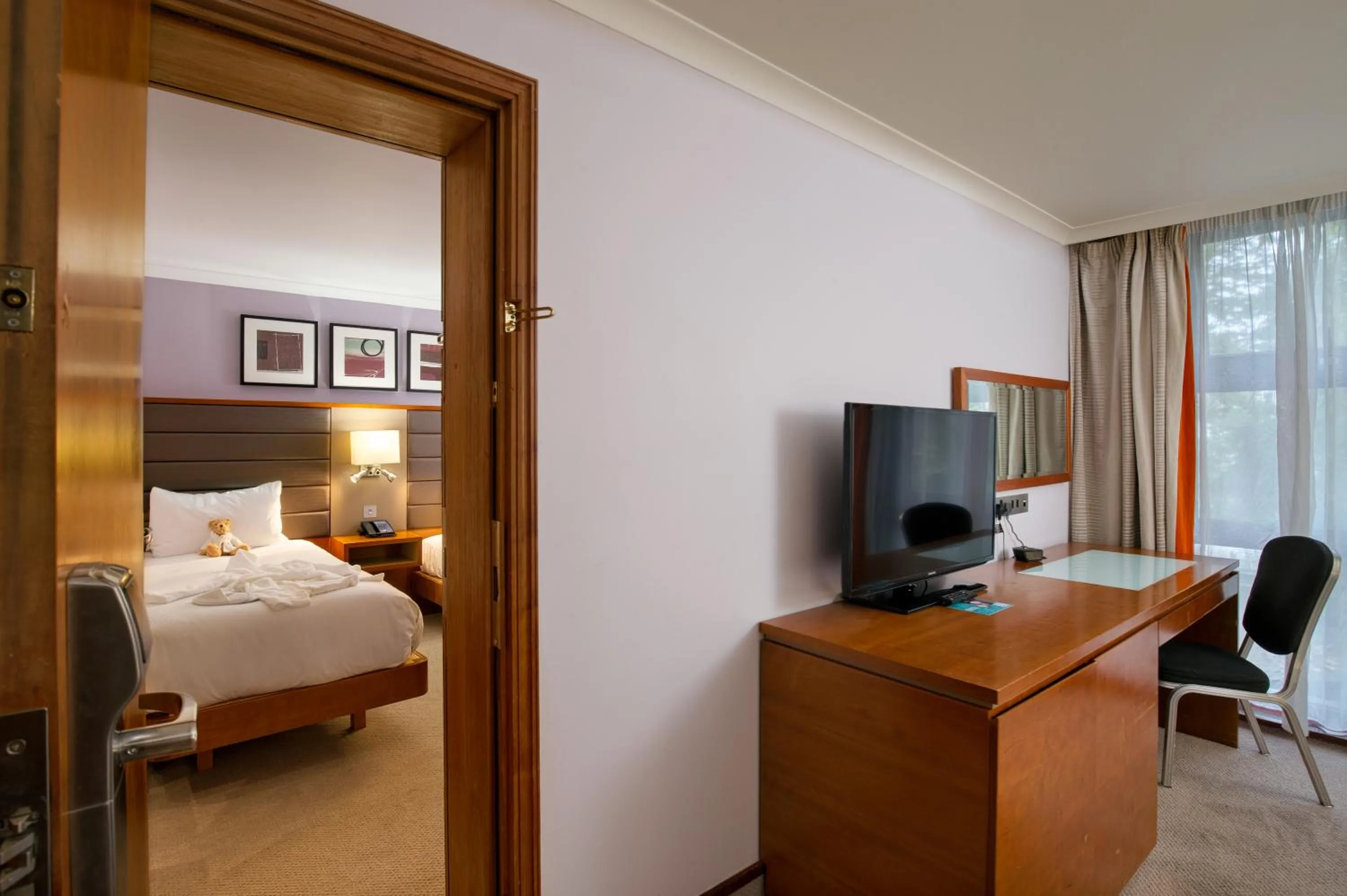 Bed in Hilton London Kensington Hotel