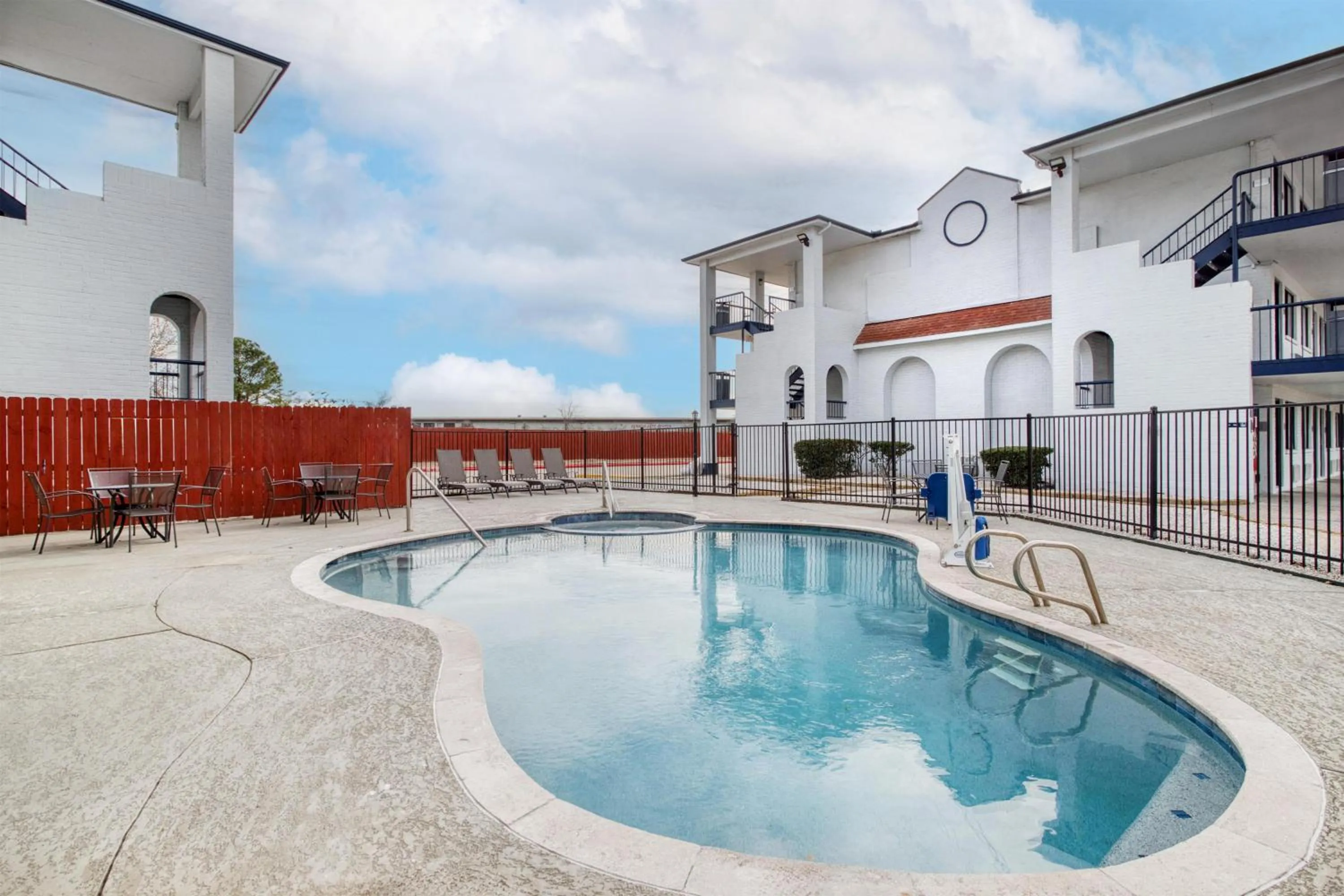 Pool view in SureStay Hotel by Best Western Spring North Houston