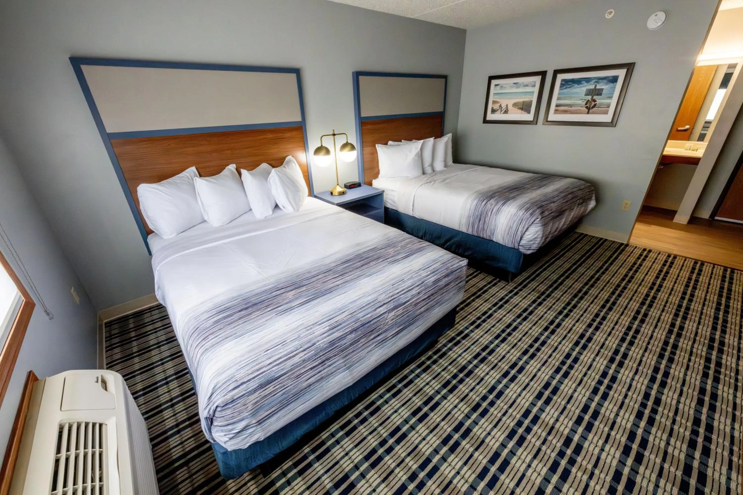 Bed in AmericInn by Wyndham Sturgeon Bay