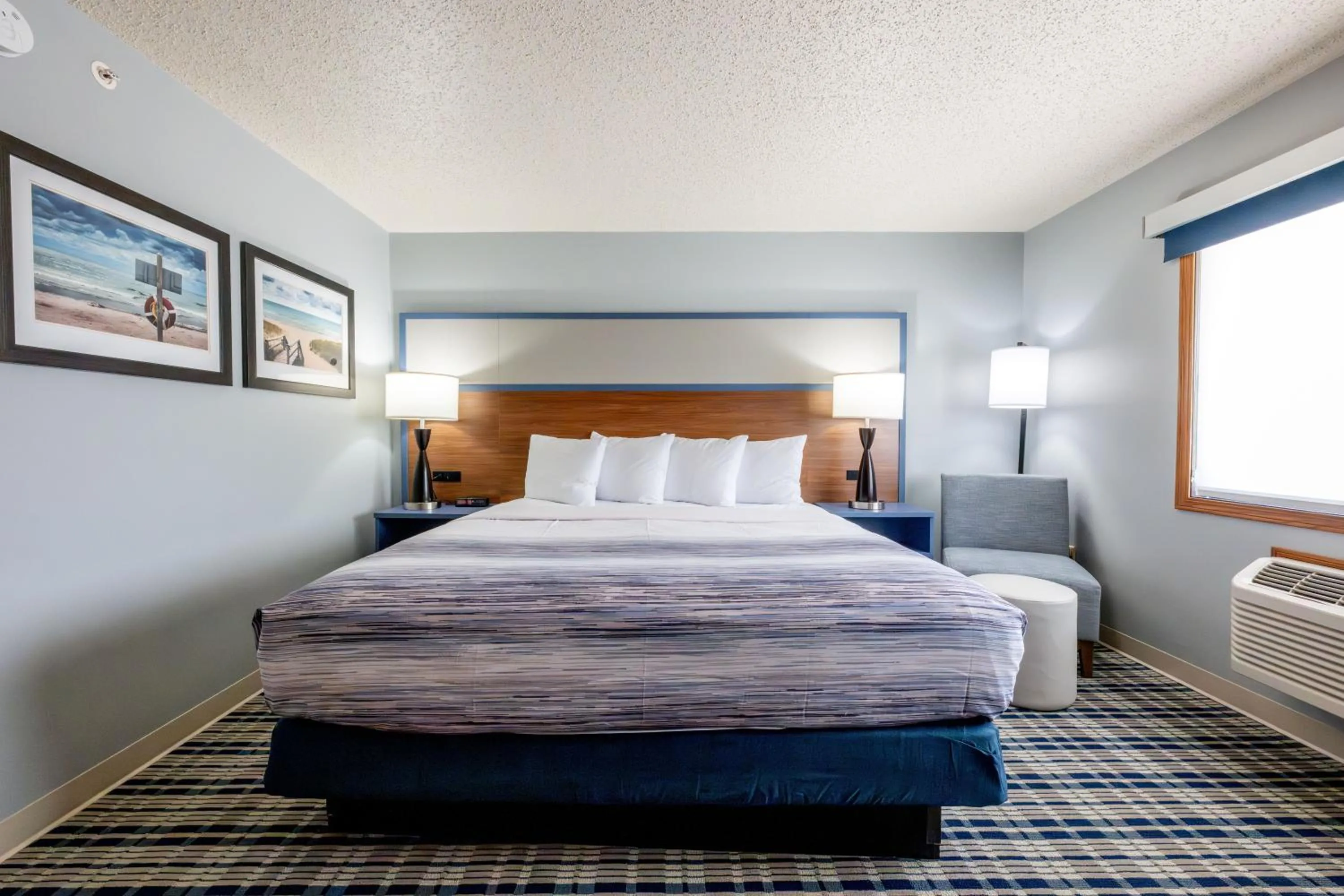 Bed in AmericInn by Wyndham Sturgeon Bay
