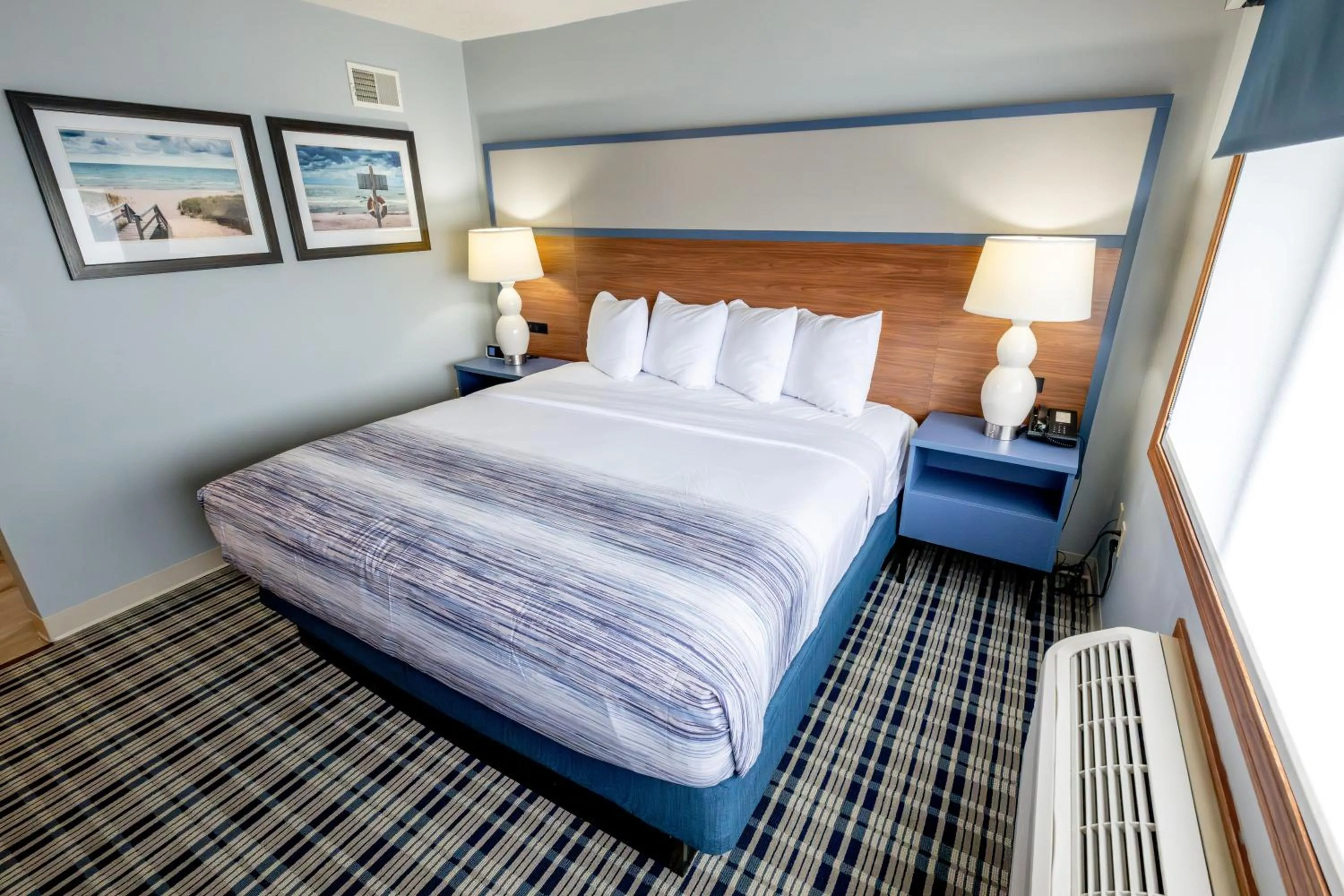 Bed in AmericInn by Wyndham Sturgeon Bay