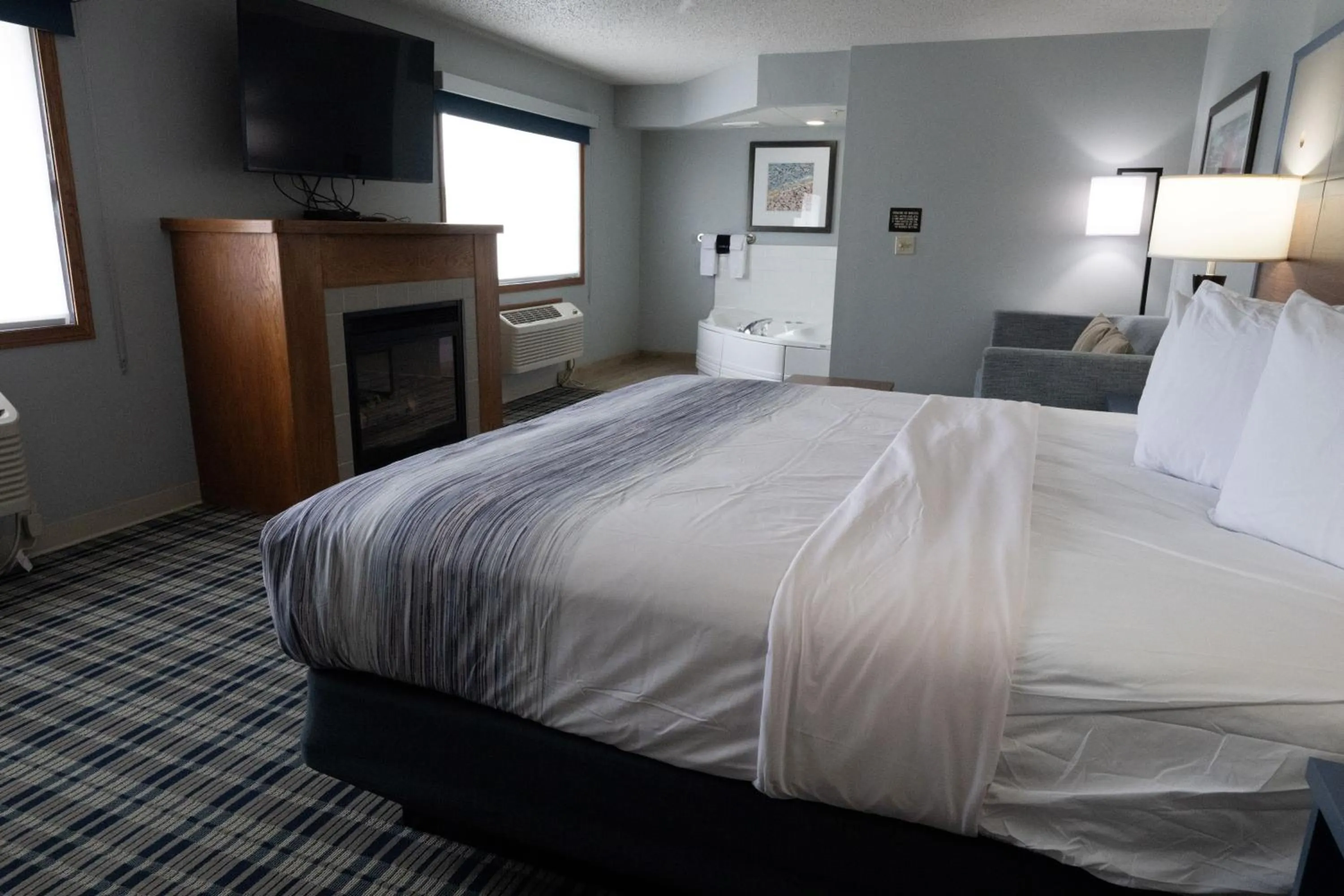 Bed in AmericInn by Wyndham Sturgeon Bay