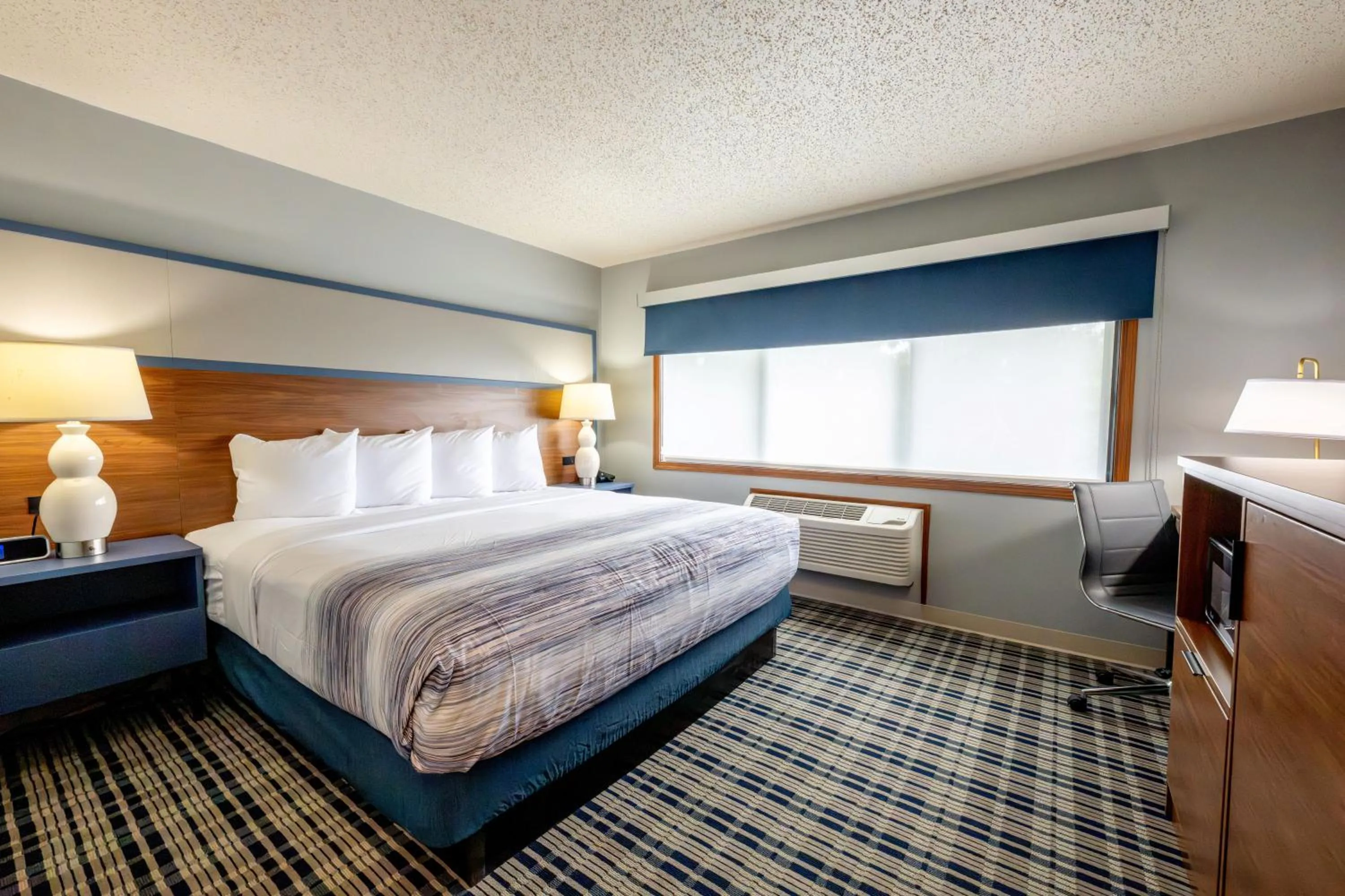 Bed in AmericInn by Wyndham Sturgeon Bay