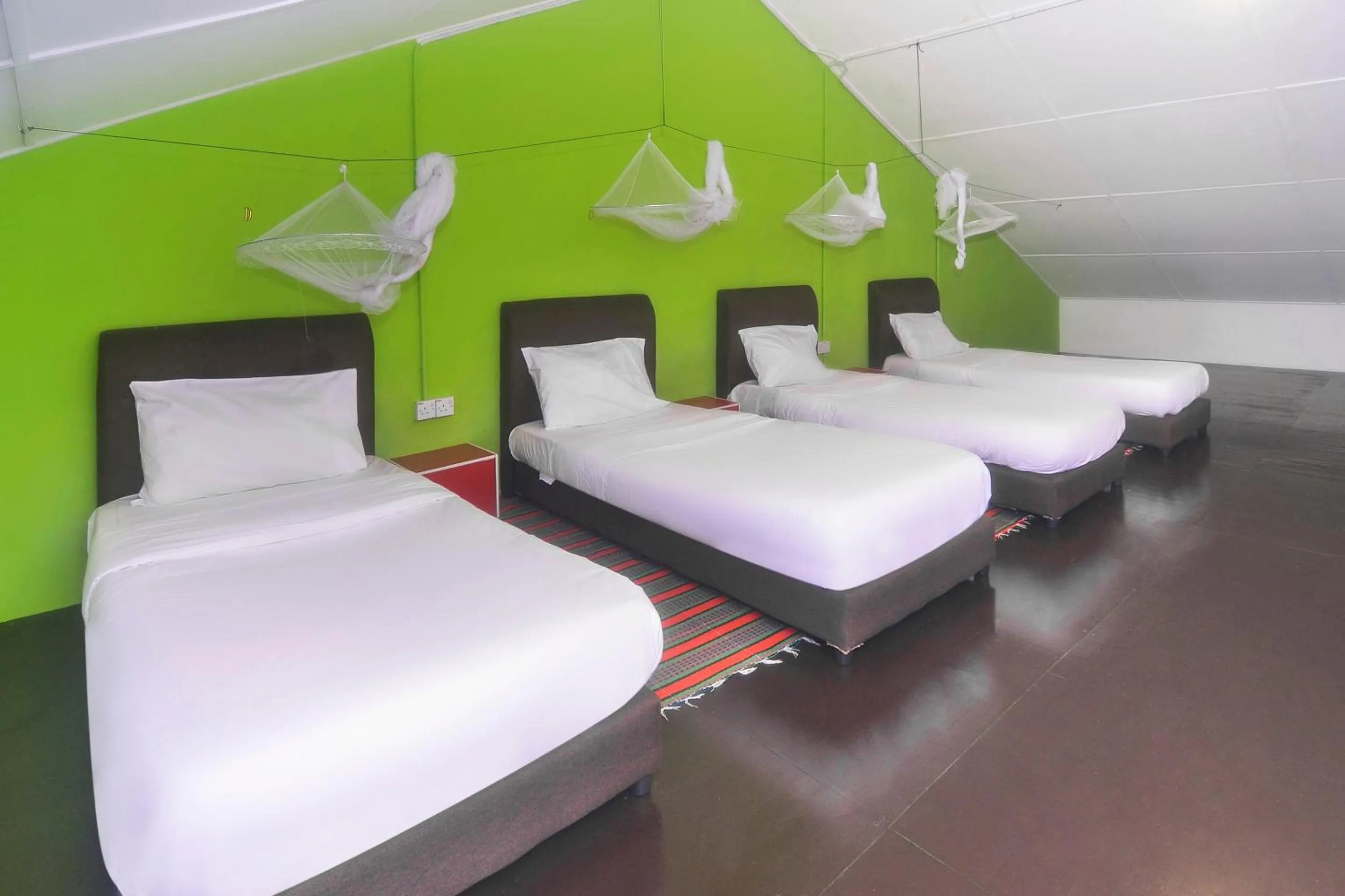 Bedroom in Hotel O Tropical Lodge