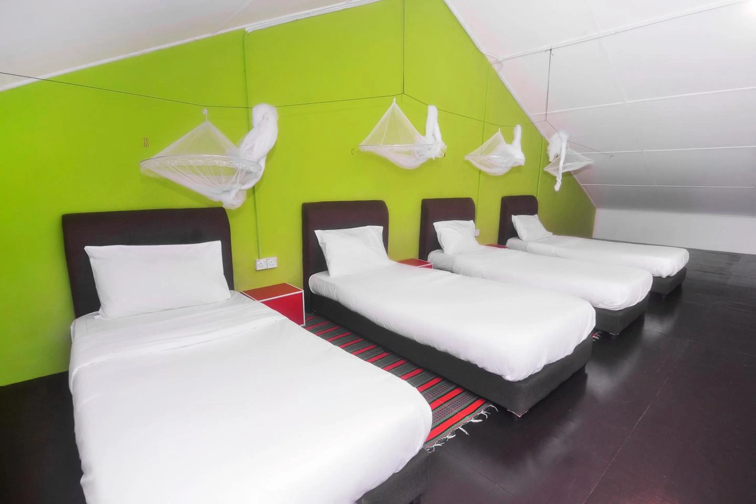 Bedroom in Hotel O Tropical Lodge