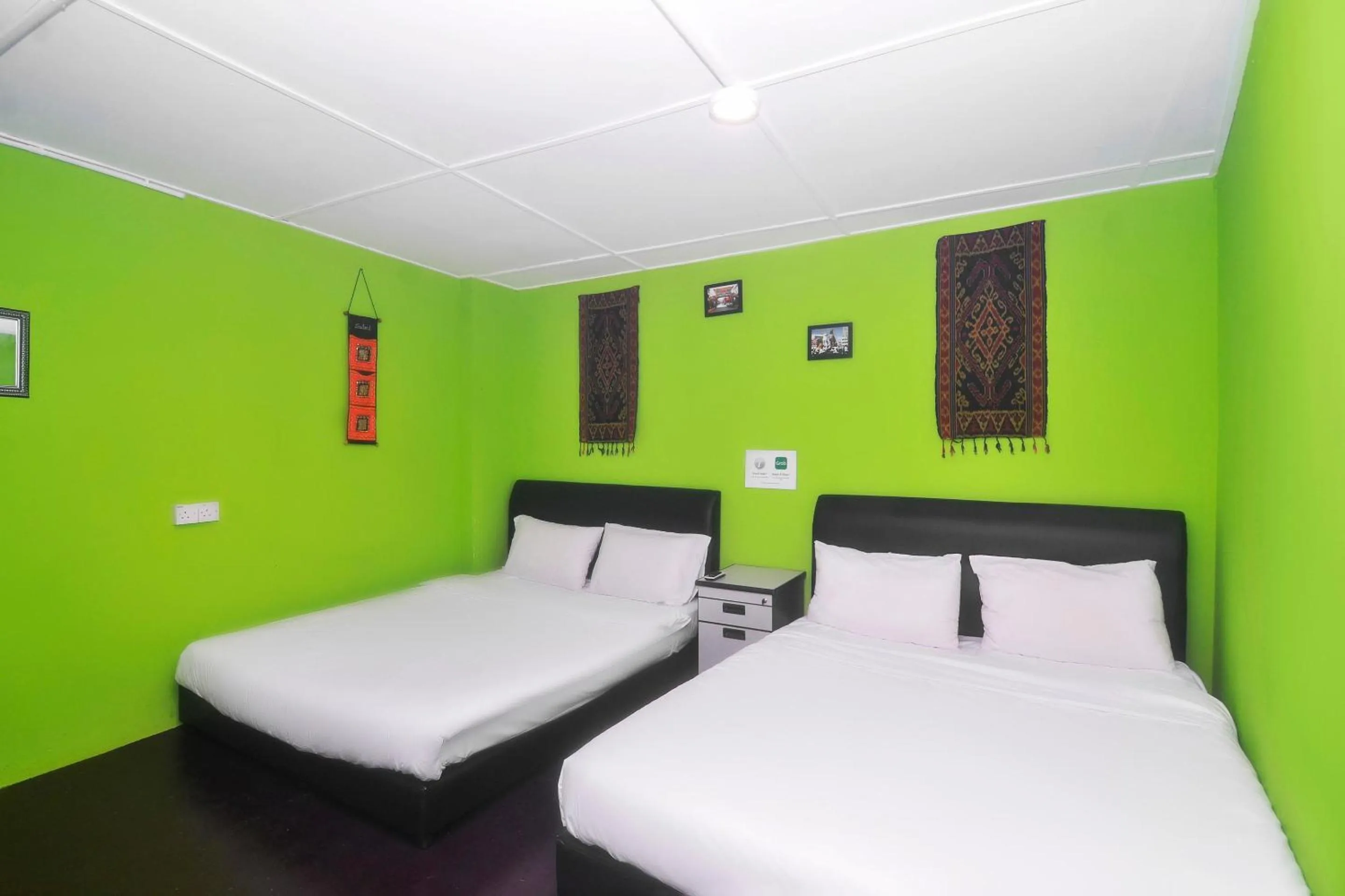 Bedroom in Hotel O Tropical Lodge