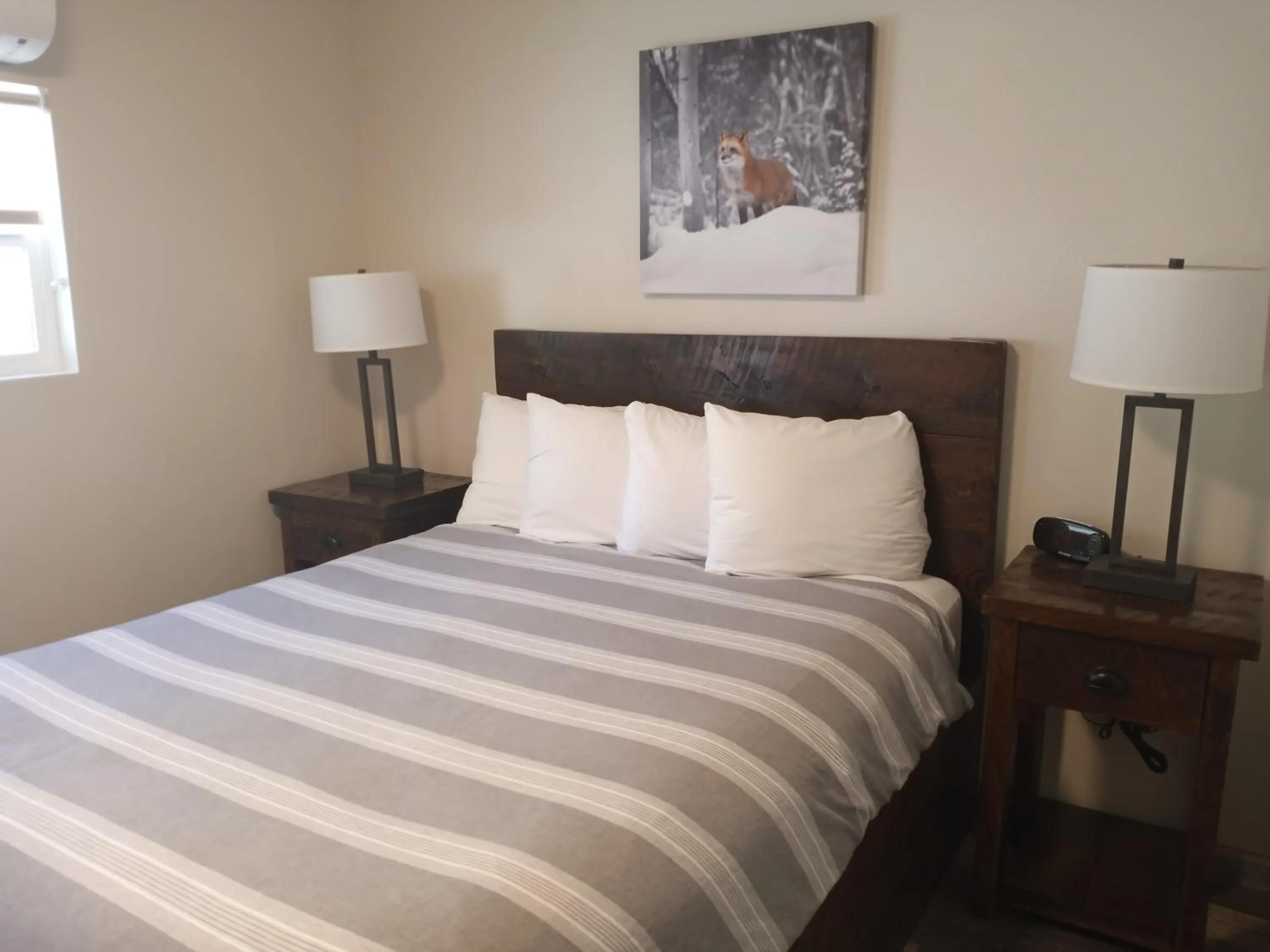 Bed in Yellowstone Riverside Cottages