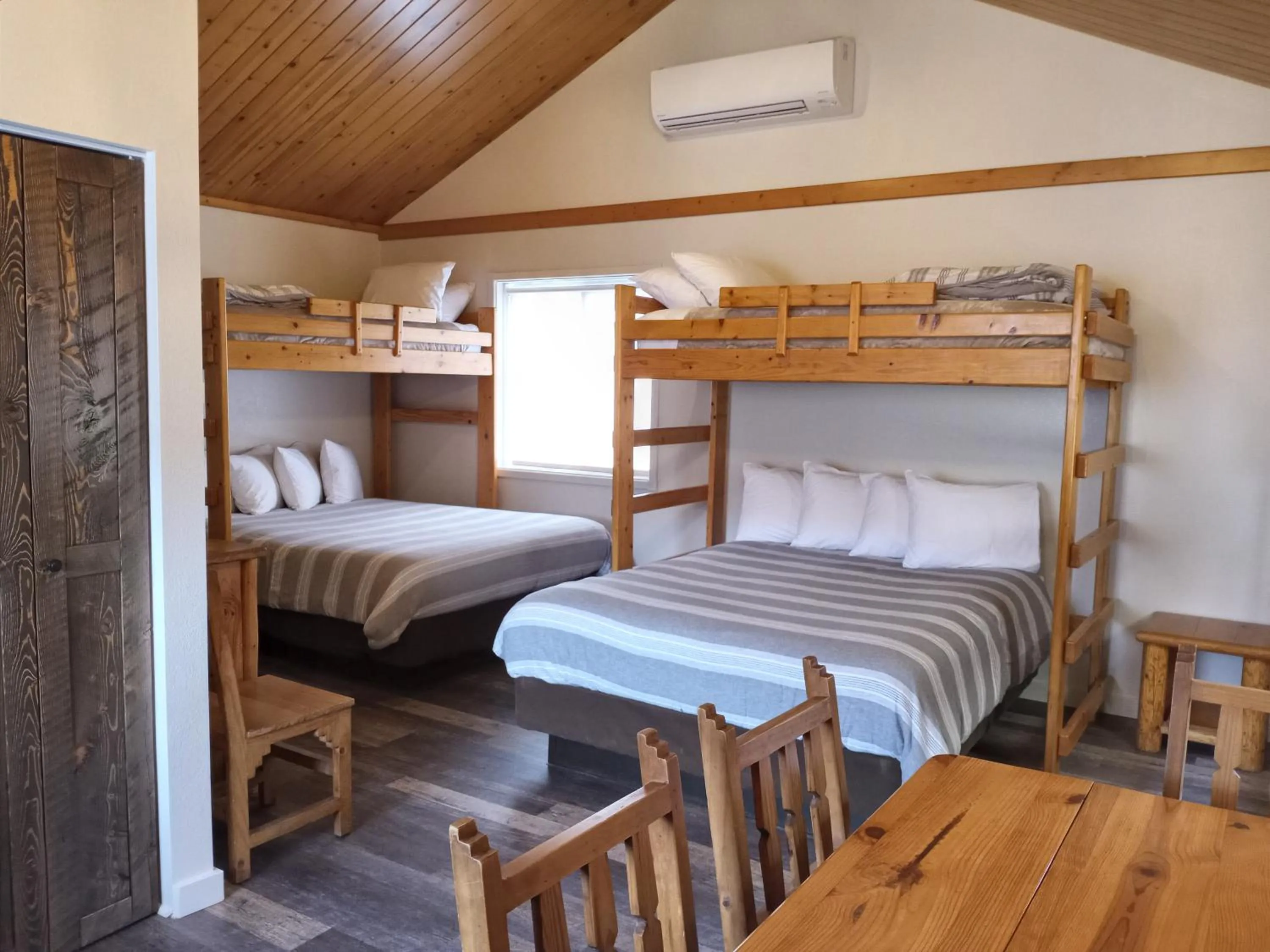 Bed in Yellowstone Riverside Cottages