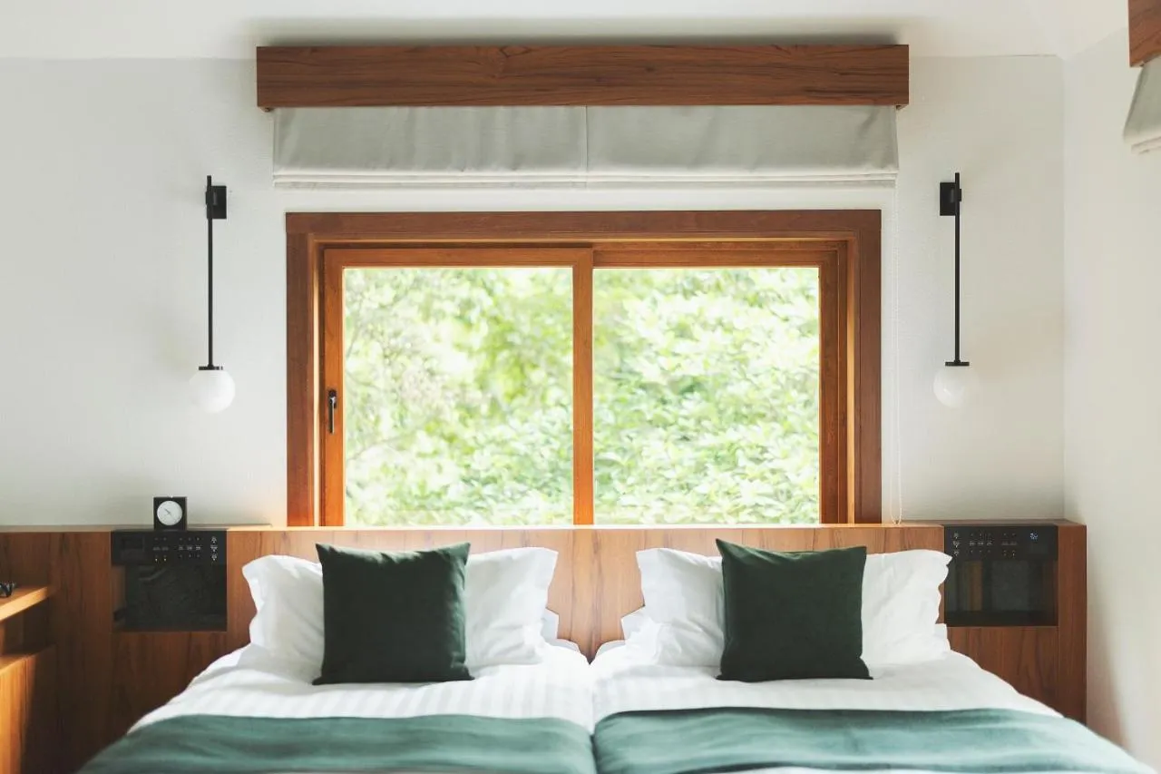 Bed in Sankara Hotel & Spa Yakushima