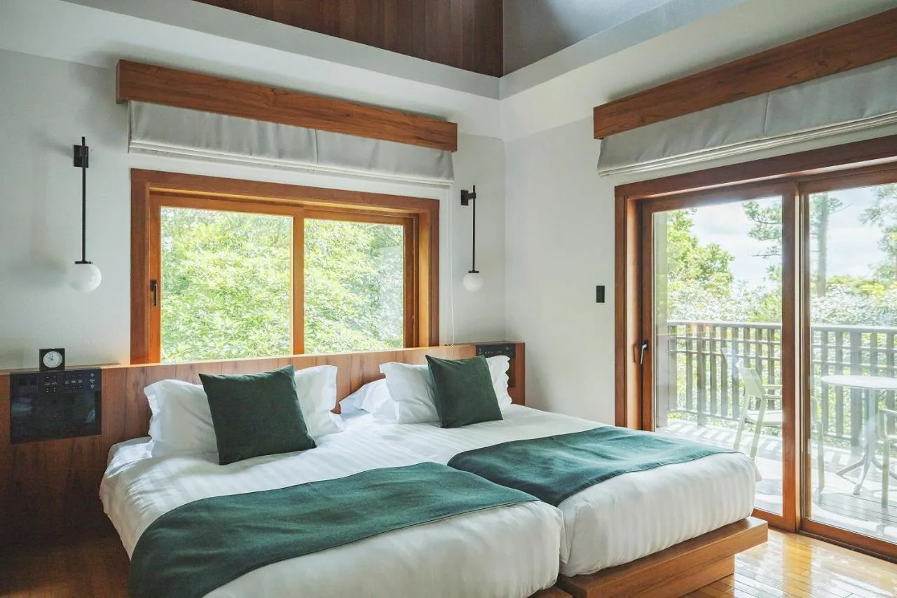 Bed in Sankara Hotel & Spa Yakushima