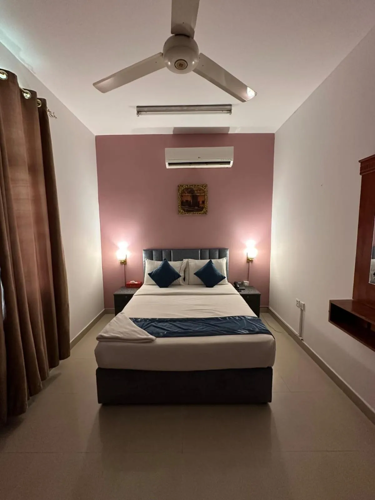 Bed in Savoy Inn Hotel Apartments