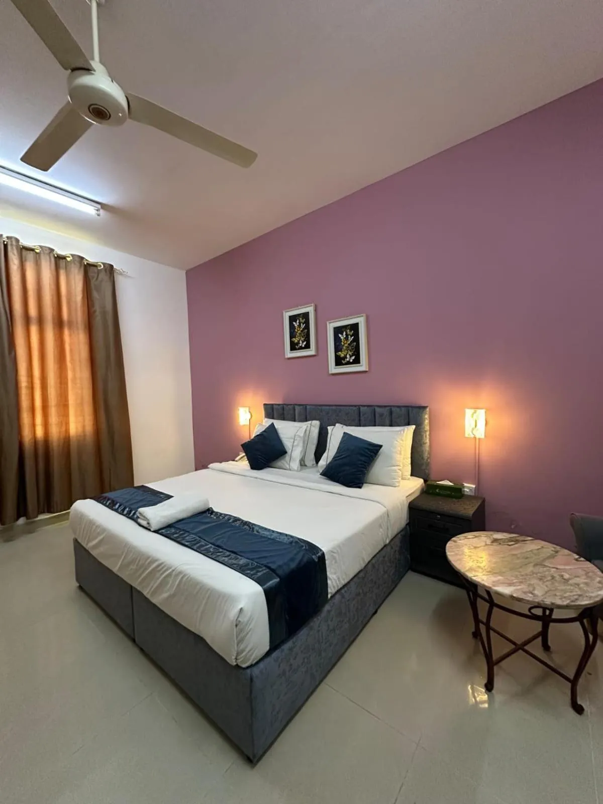 Bed in Savoy Inn Hotel Apartments