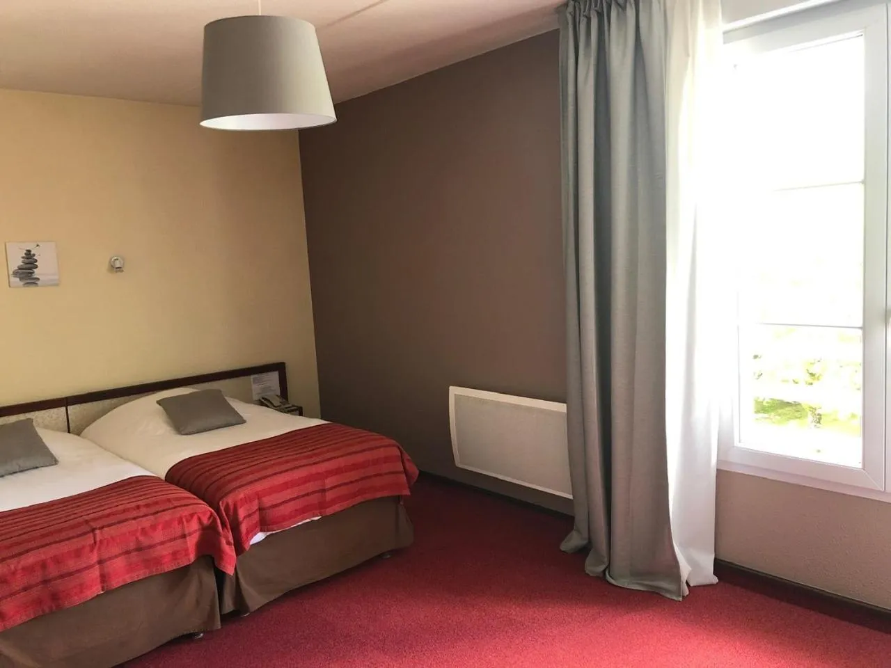 Bed in Hôtel et Studios d'Orfeuil