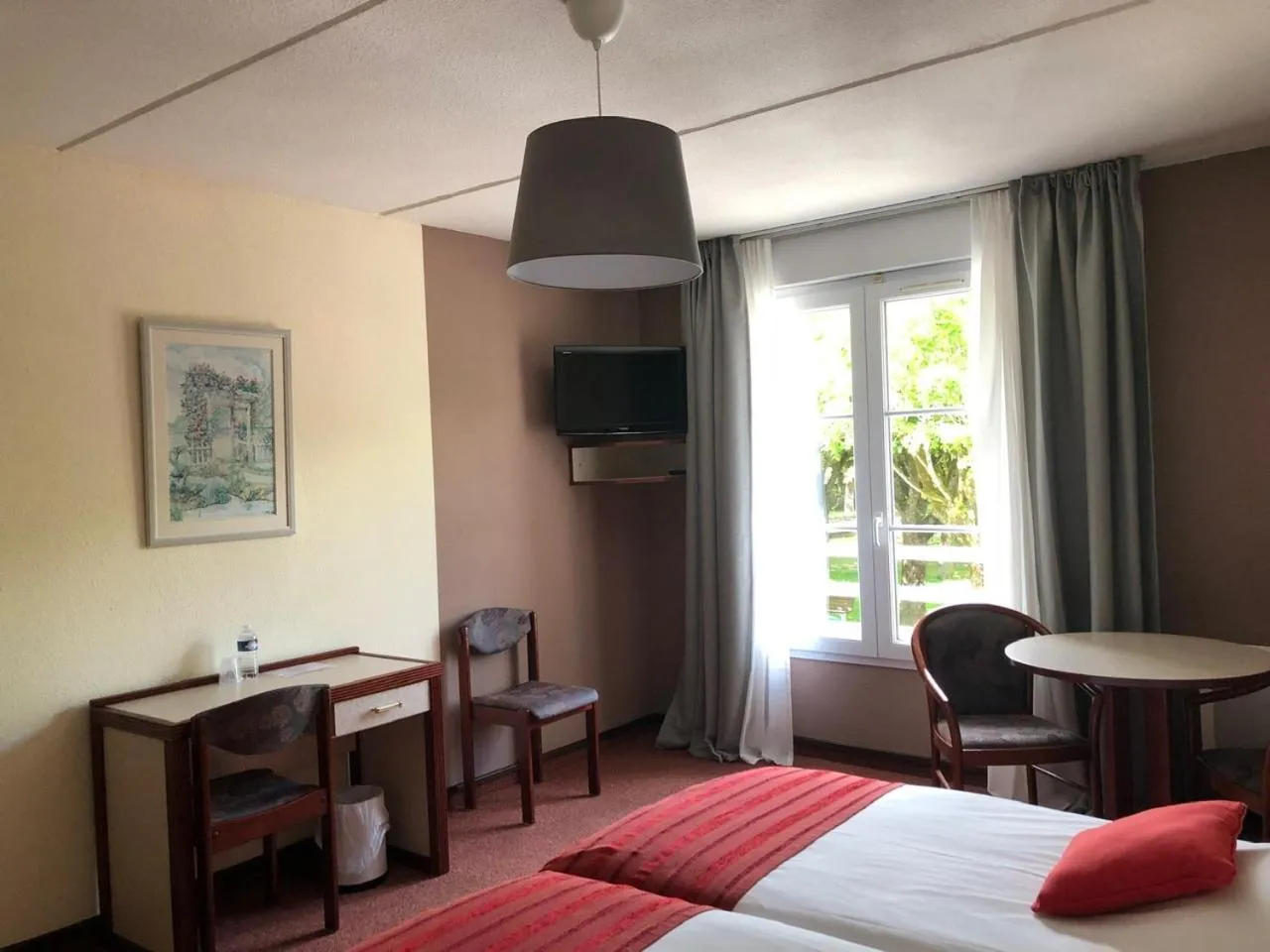 Bed in Hôtel et Studios d'Orfeuil