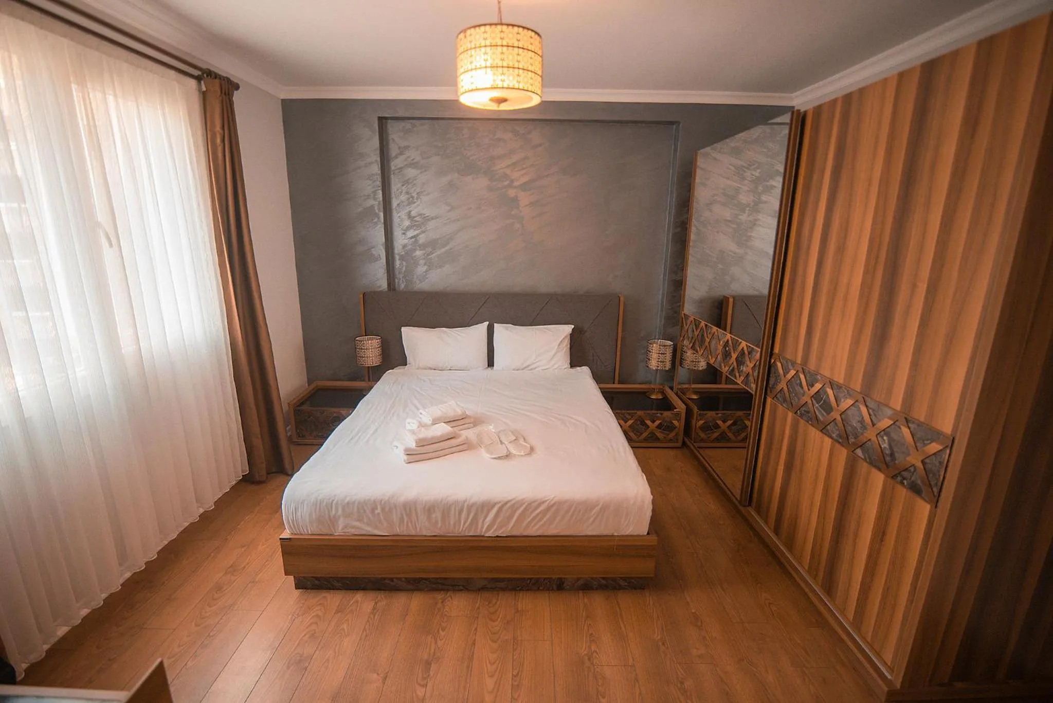 Bed in Royal Comfort Hotel