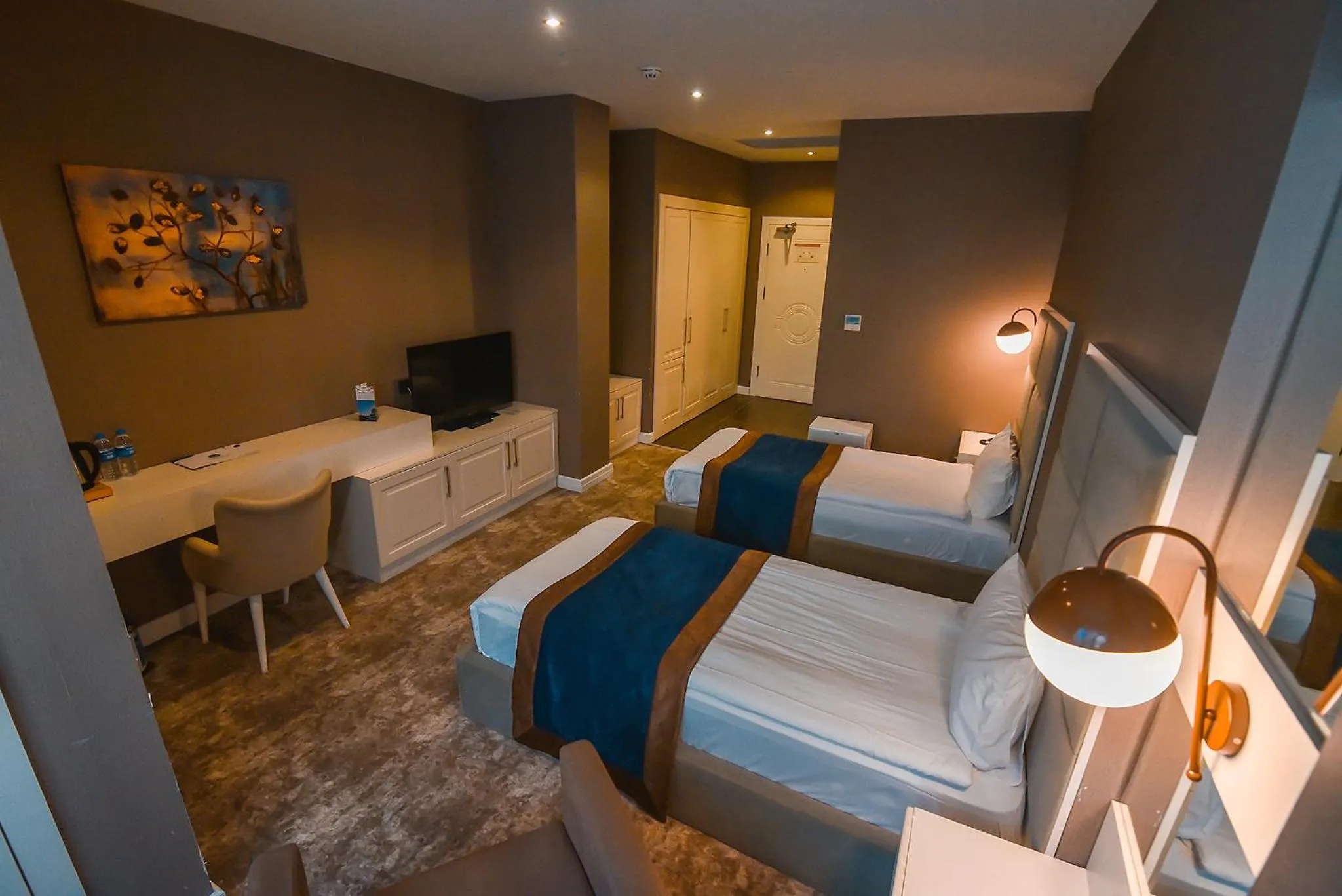 Bed in Royal Comfort Hotel