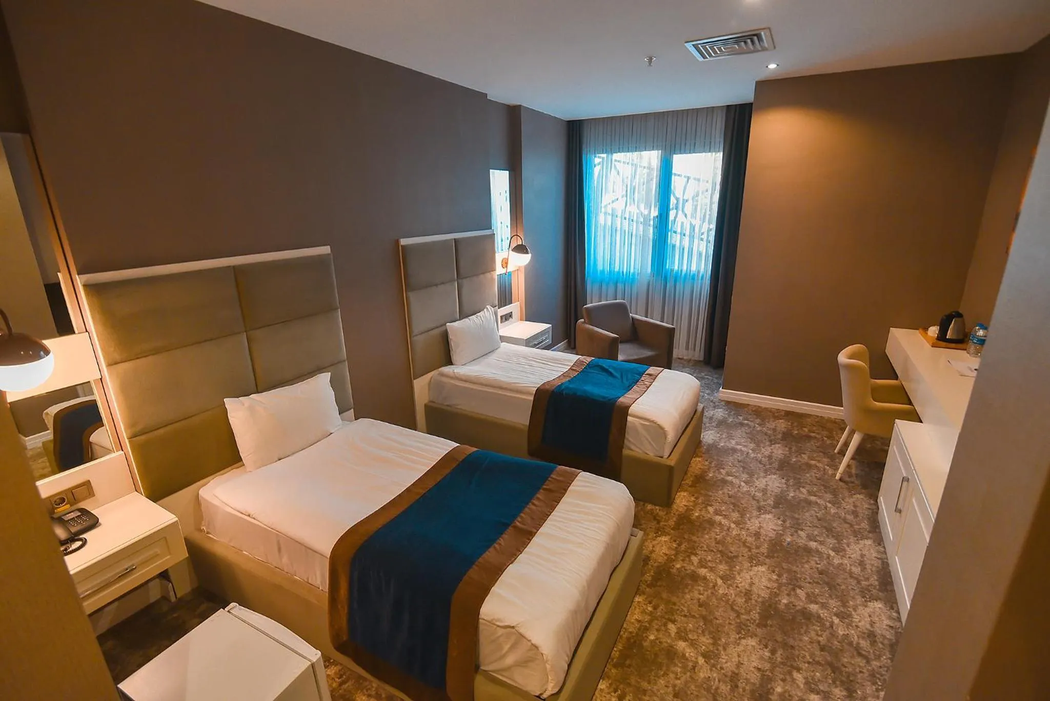 Bed in Royal Comfort Hotel