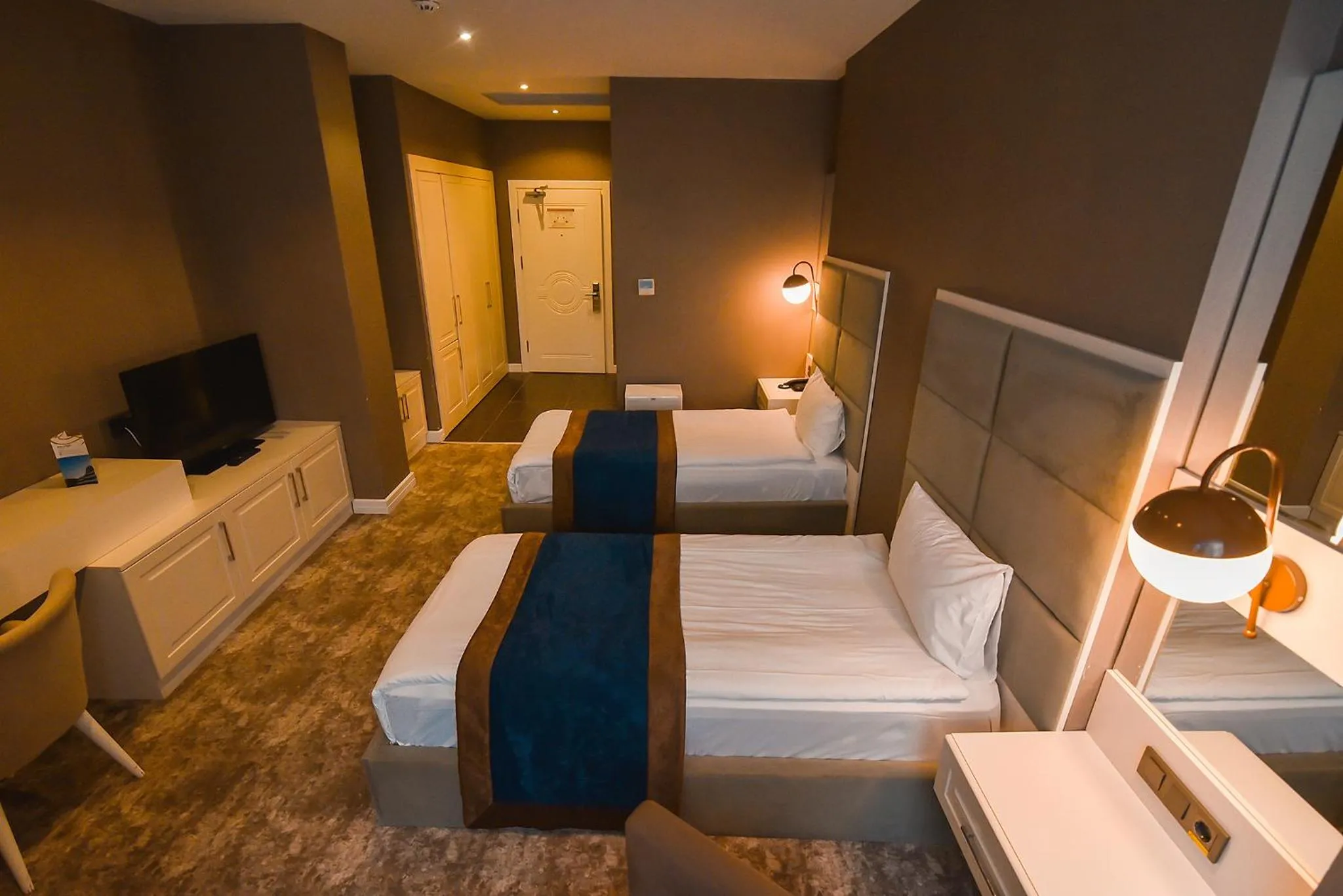 Bed in Royal Comfort Hotel