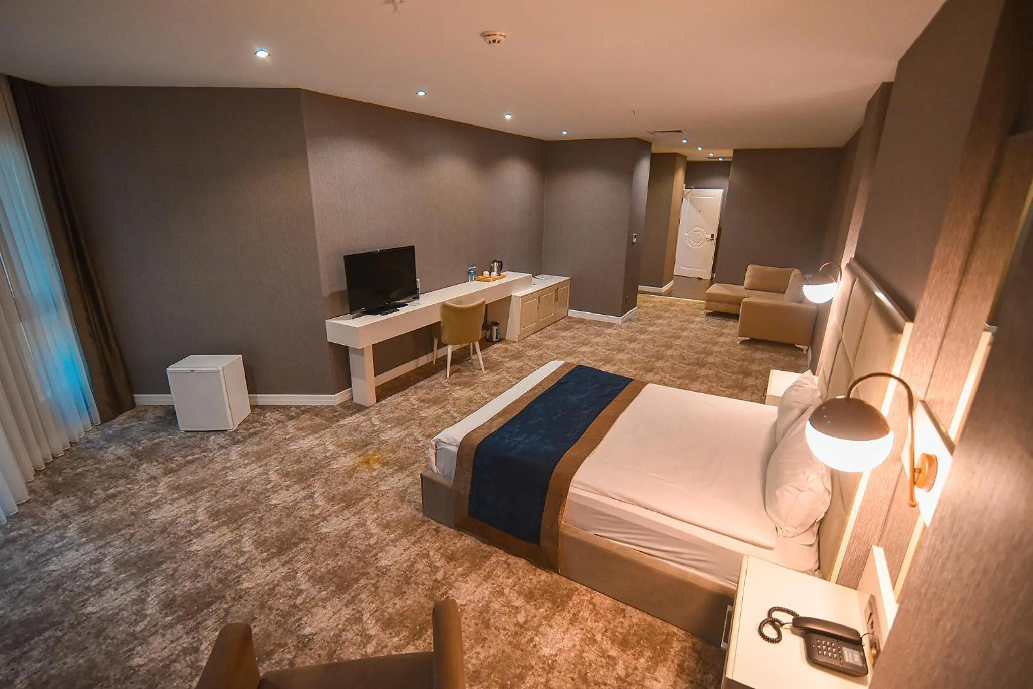 Bed in Royal Comfort Hotel