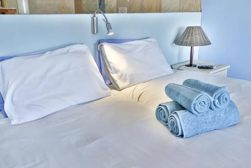 Bed in Oyster Bay Beach Lodge