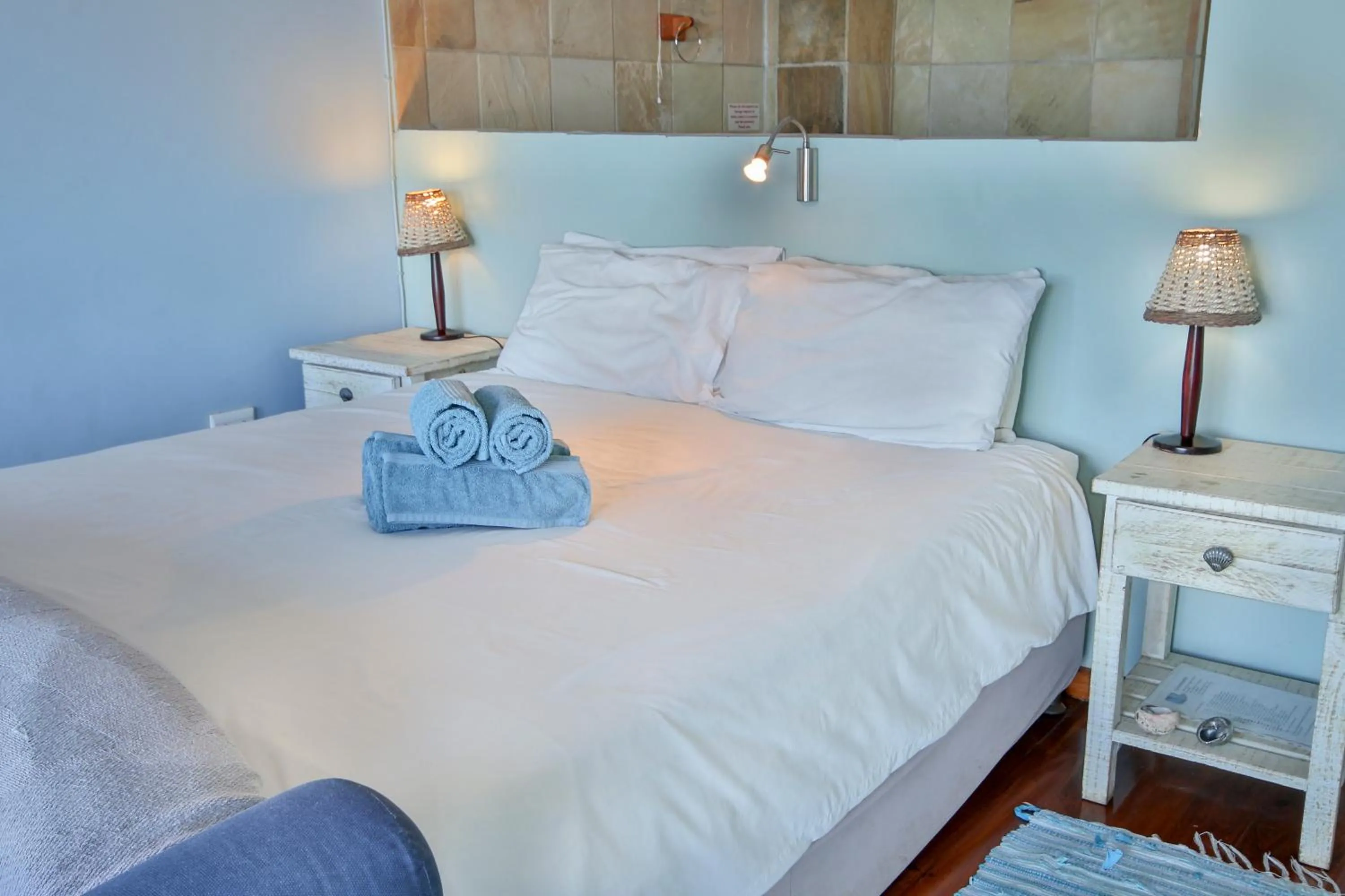 Bed in Oyster Bay Beach Lodge