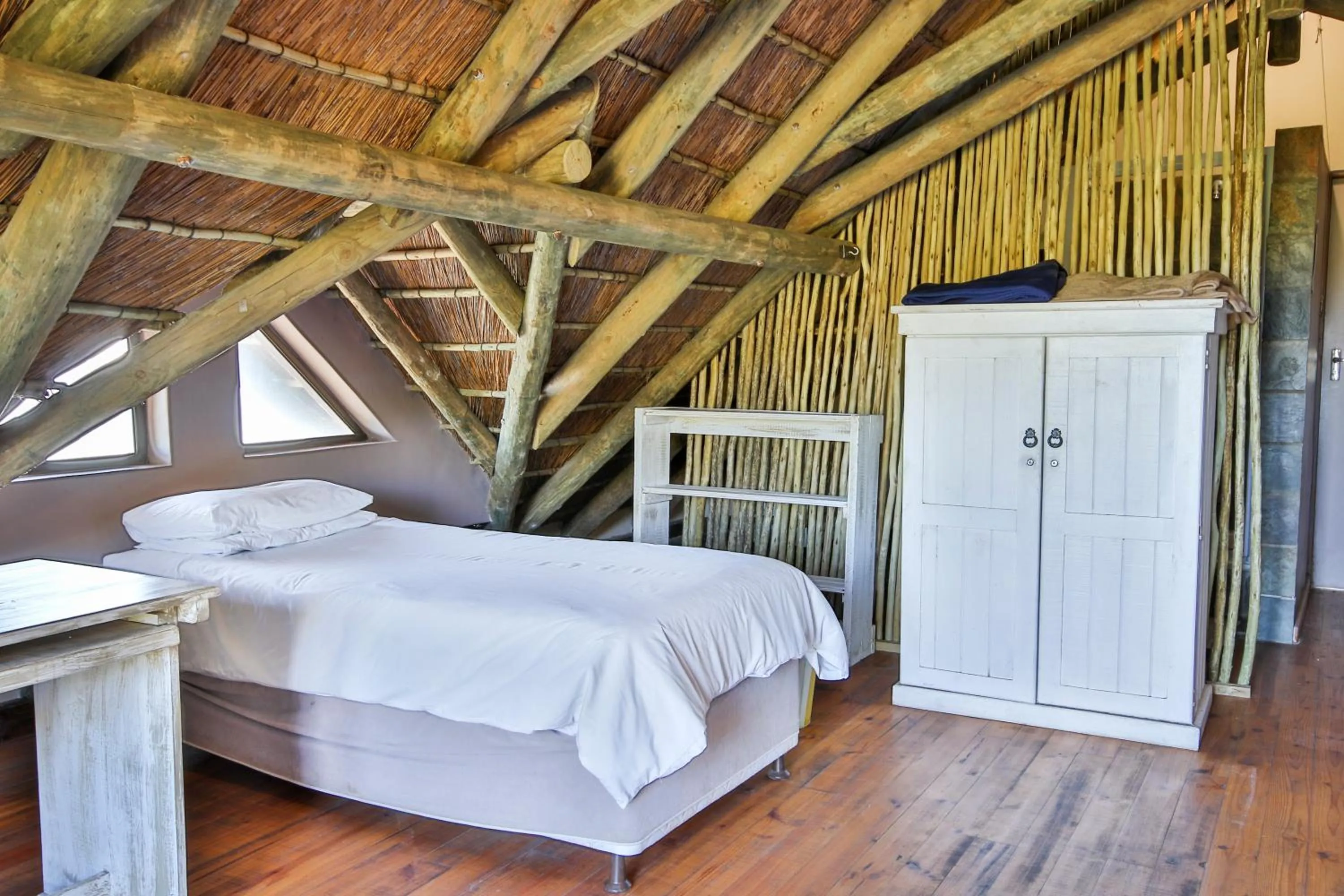 Bed in Oyster Bay Beach Lodge