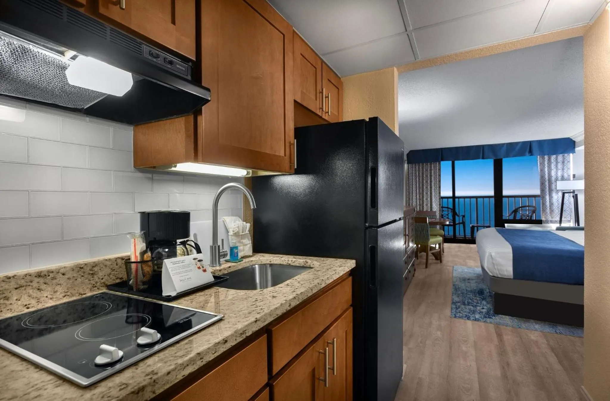 Kitchen or kitchenette, Bed in Sea Crest Oceanfront Resort