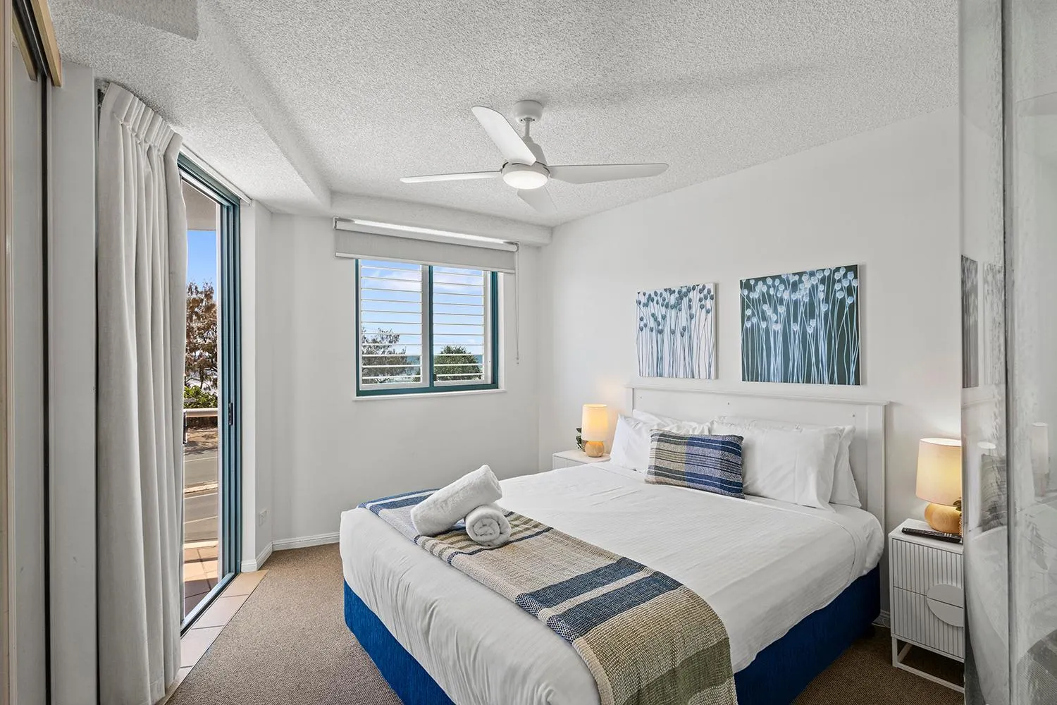 Bed in Grand Palais Boolarong Beachside Apartments