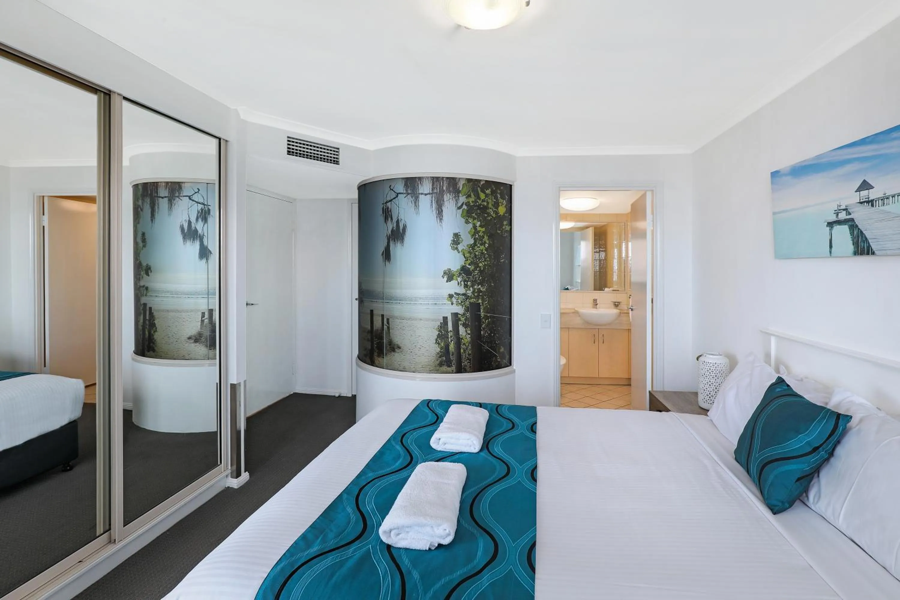 Bed in Grand Palais Boolarong Beachside Apartments