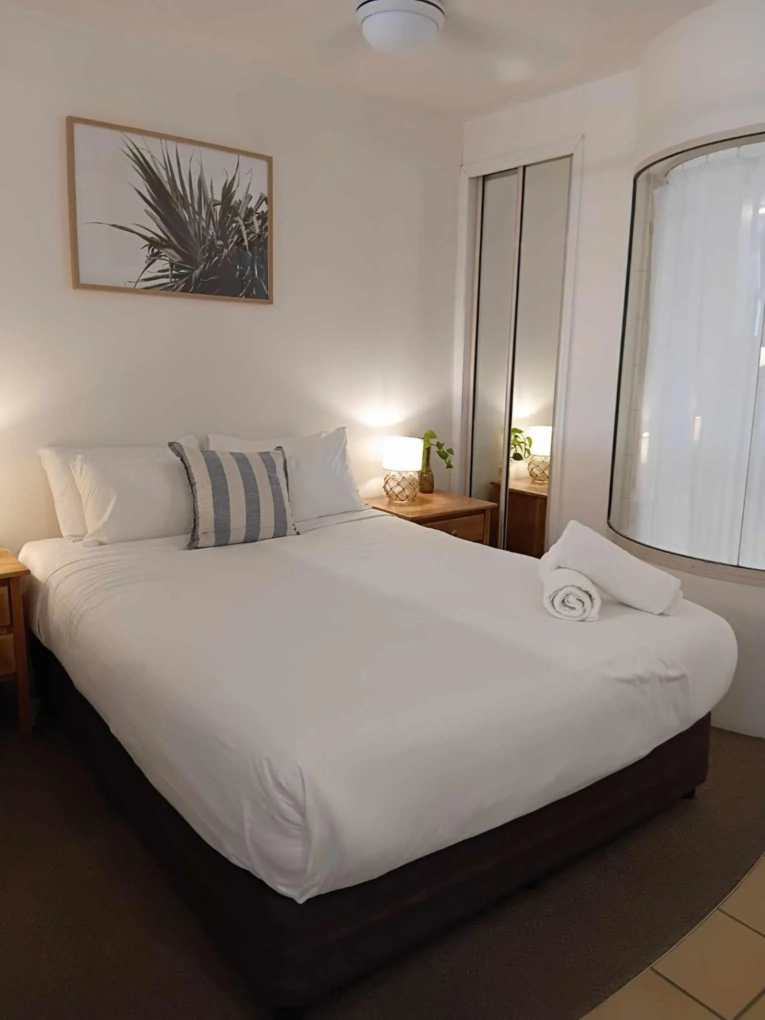Bed in Grand Palais Boolarong Beachside Apartments