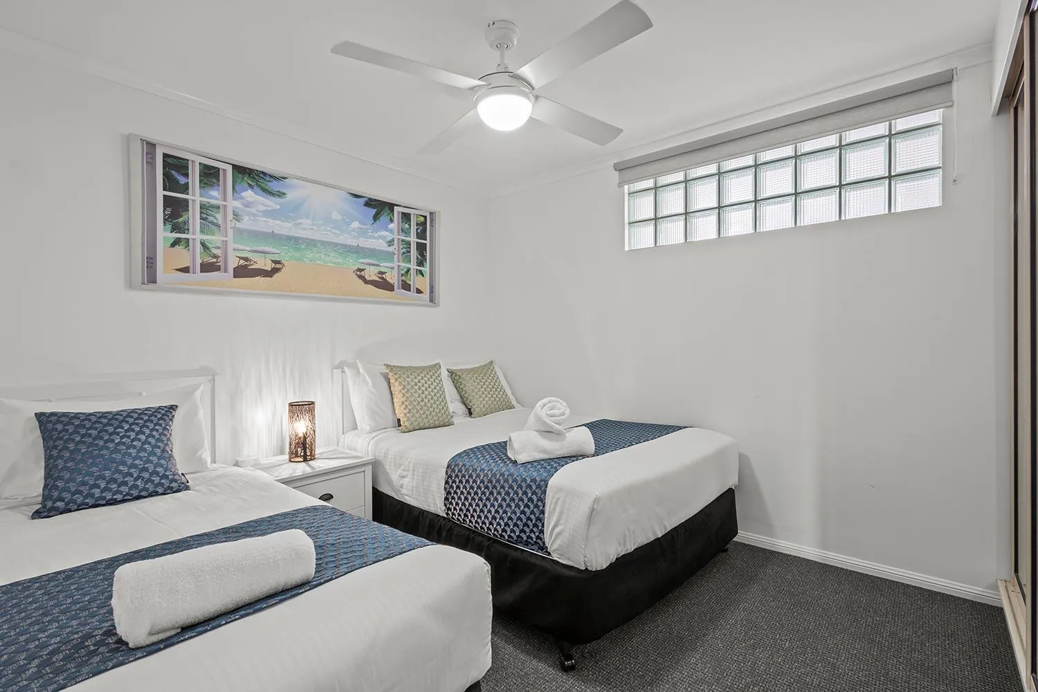 Bed in Grand Palais Boolarong Beachside Apartments