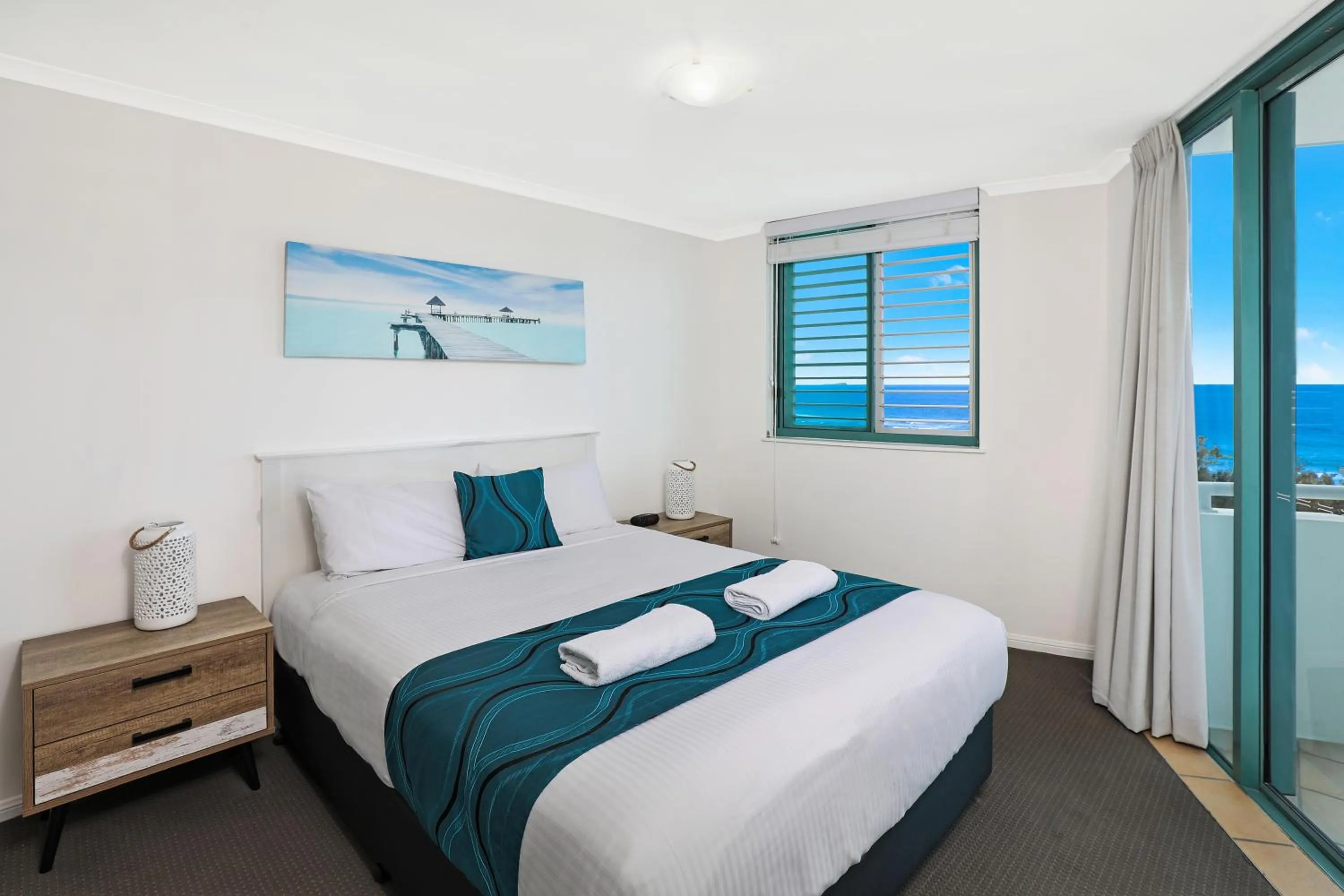 Bed in Grand Palais Boolarong Beachside Apartments