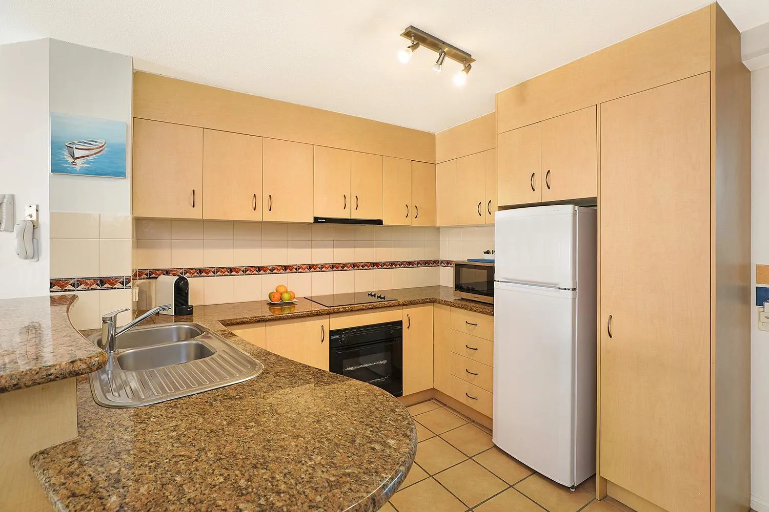 Kitchen or kitchenette in Grand Palais Boolarong Beachside Apartments