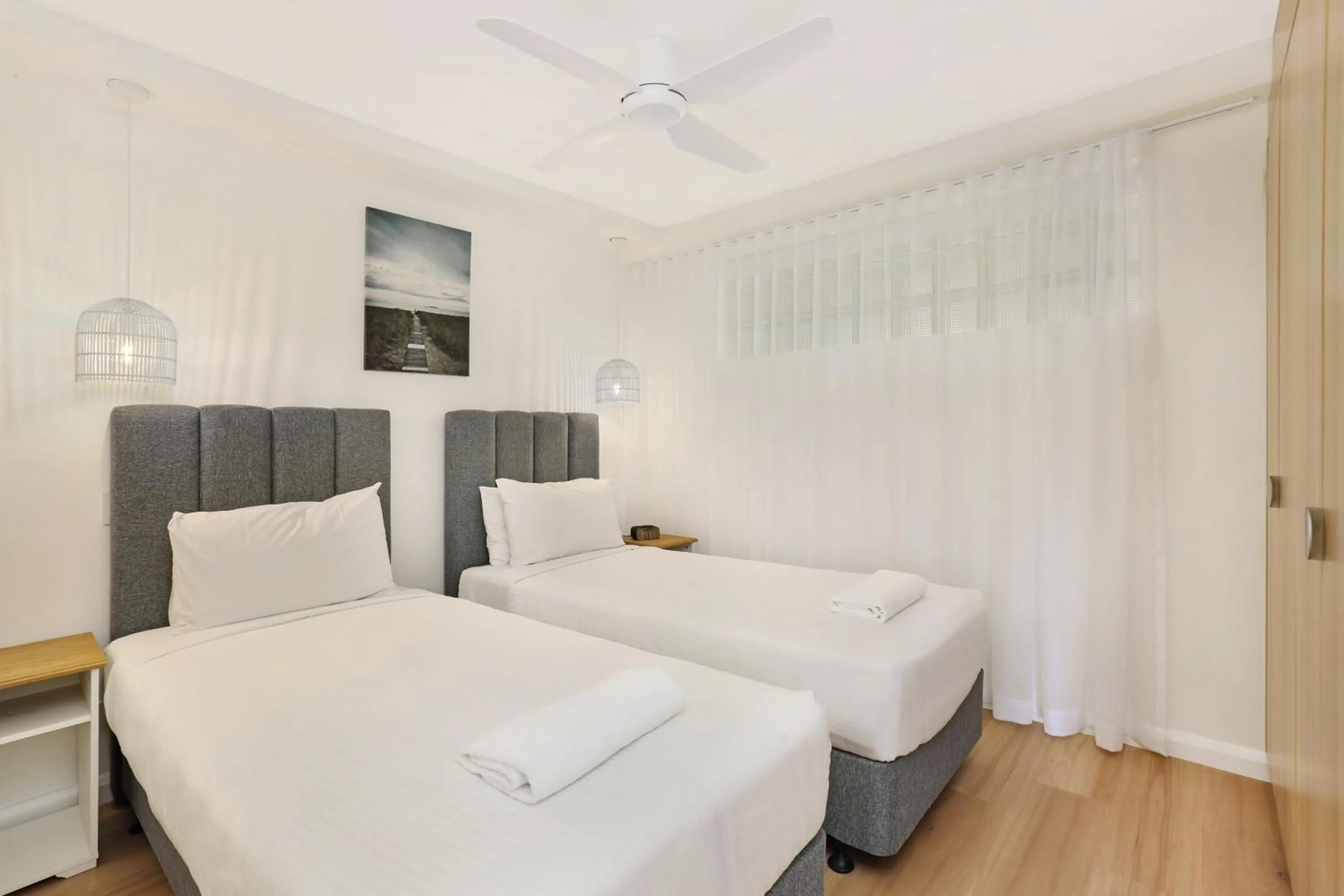 Bed in Grand Palais Boolarong Beachside Apartments