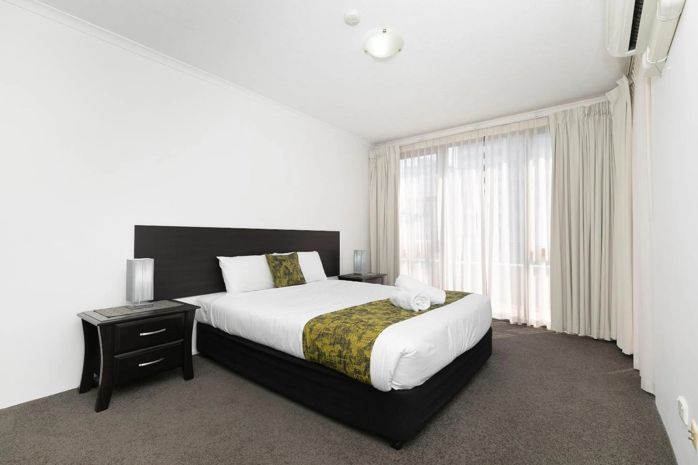 Bed in The Astor Apartments