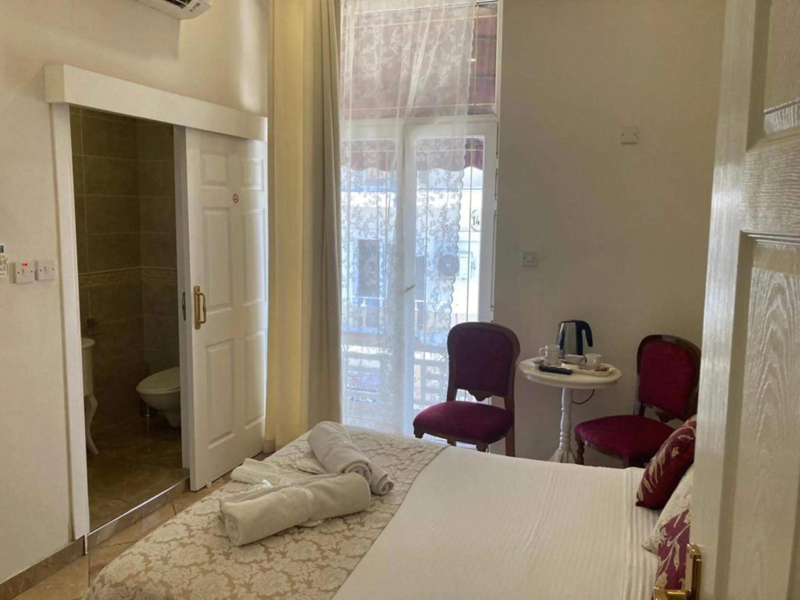 Bed in Lord's Residence Boutique Hotel