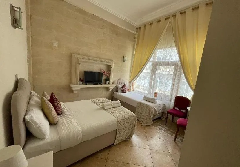 Bed in Lord's Residence Boutique Hotel