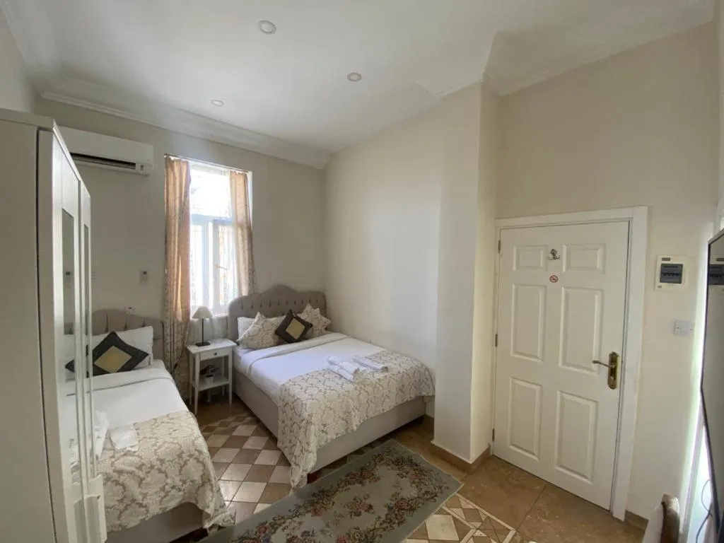 Bed in Lord's Residence Boutique Hotel