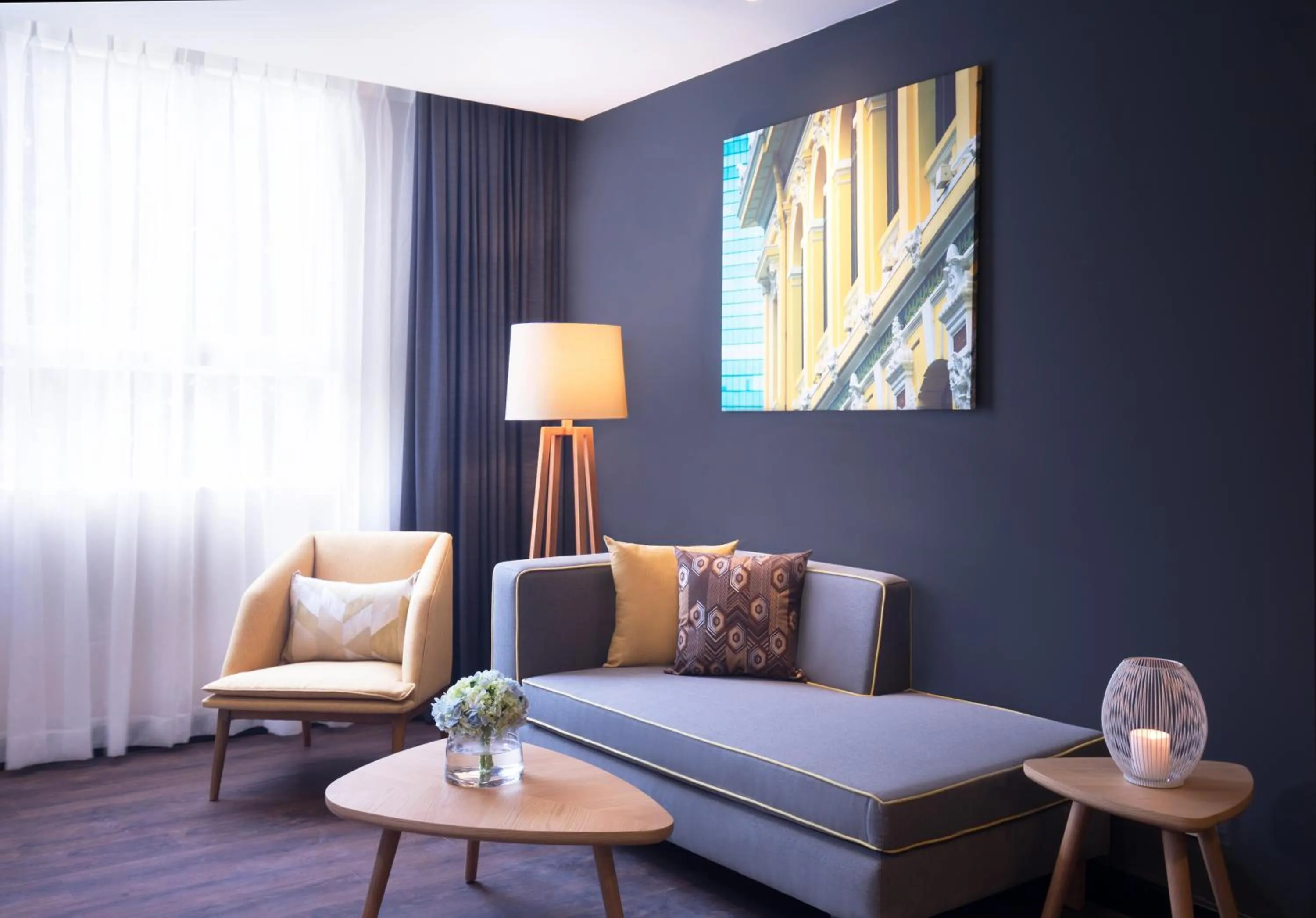 Living room, Bed in Citadines Central Binh Duong