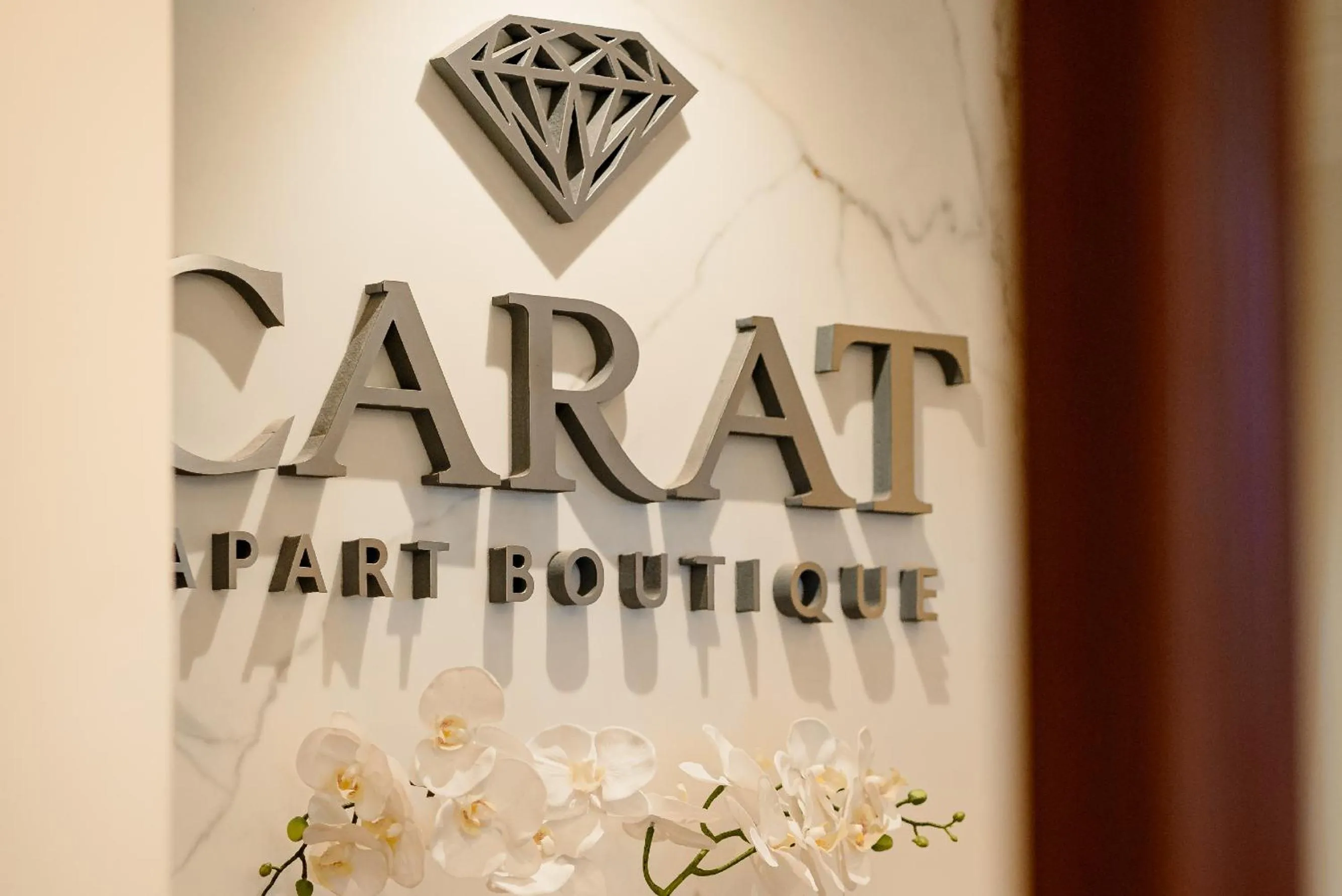 Property logo or sign in Hotel Carat Apart Boutique