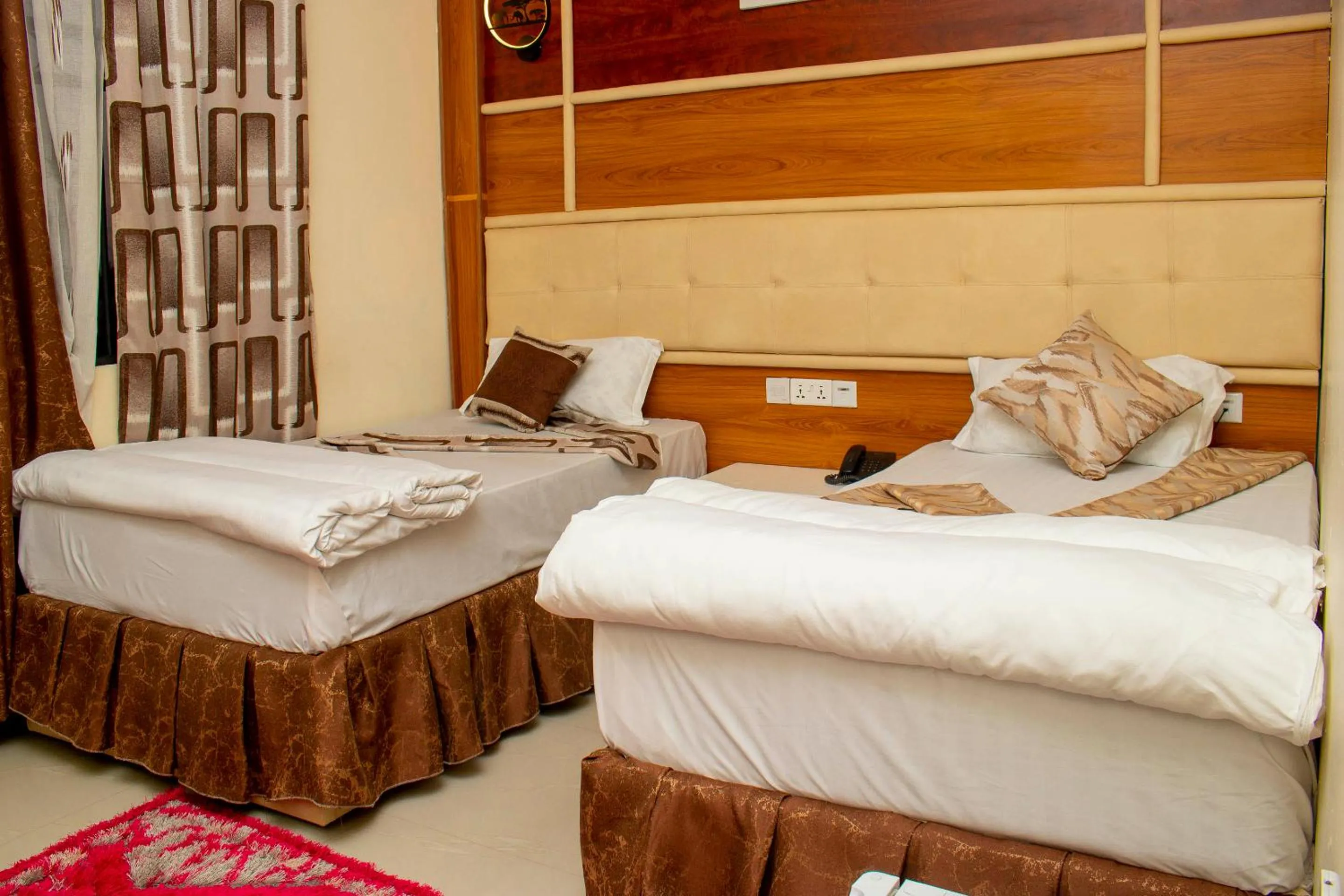 Photo of the whole room, Bed in Jaden Hotel & Lounge - Arusha