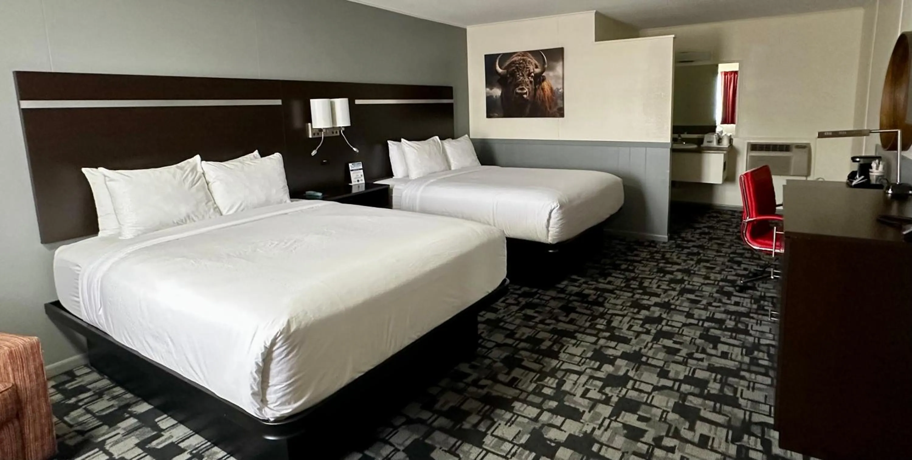 Bed in Americas Best Value Inn Wall