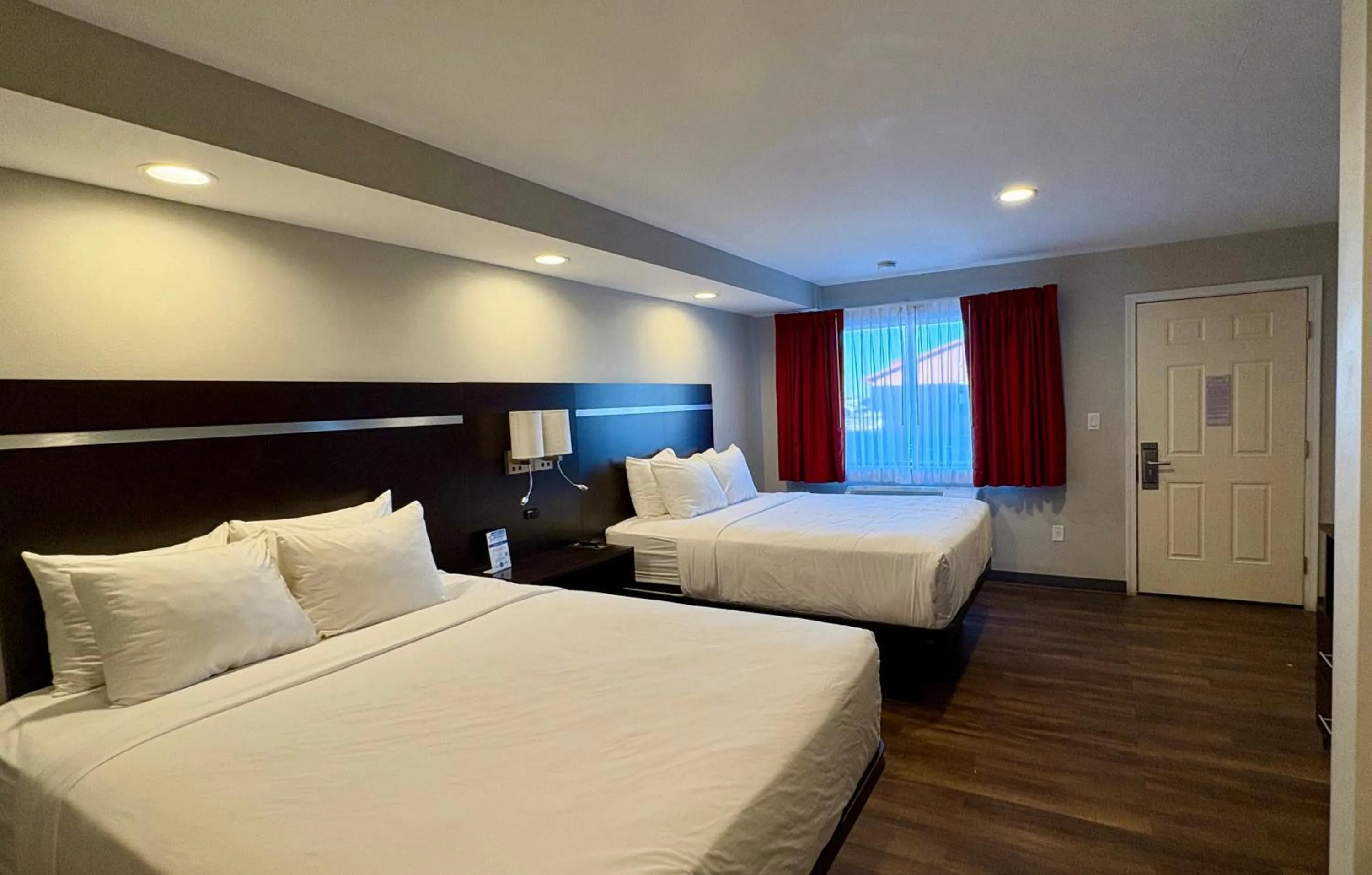 Bed in Americas Best Value Inn Wall