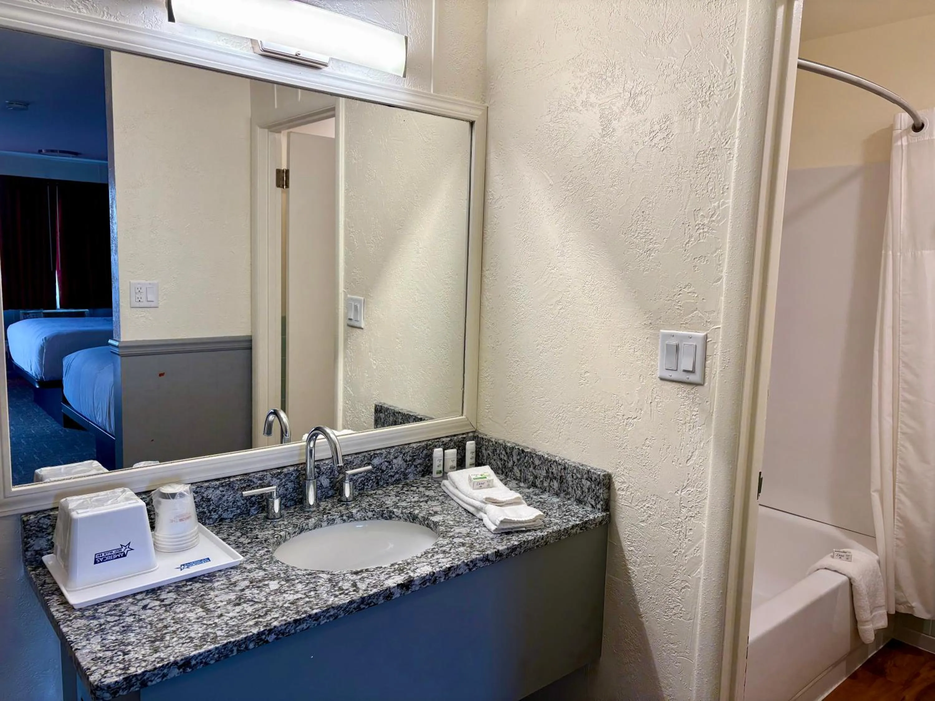 Shower in Americas Best Value Inn Wall