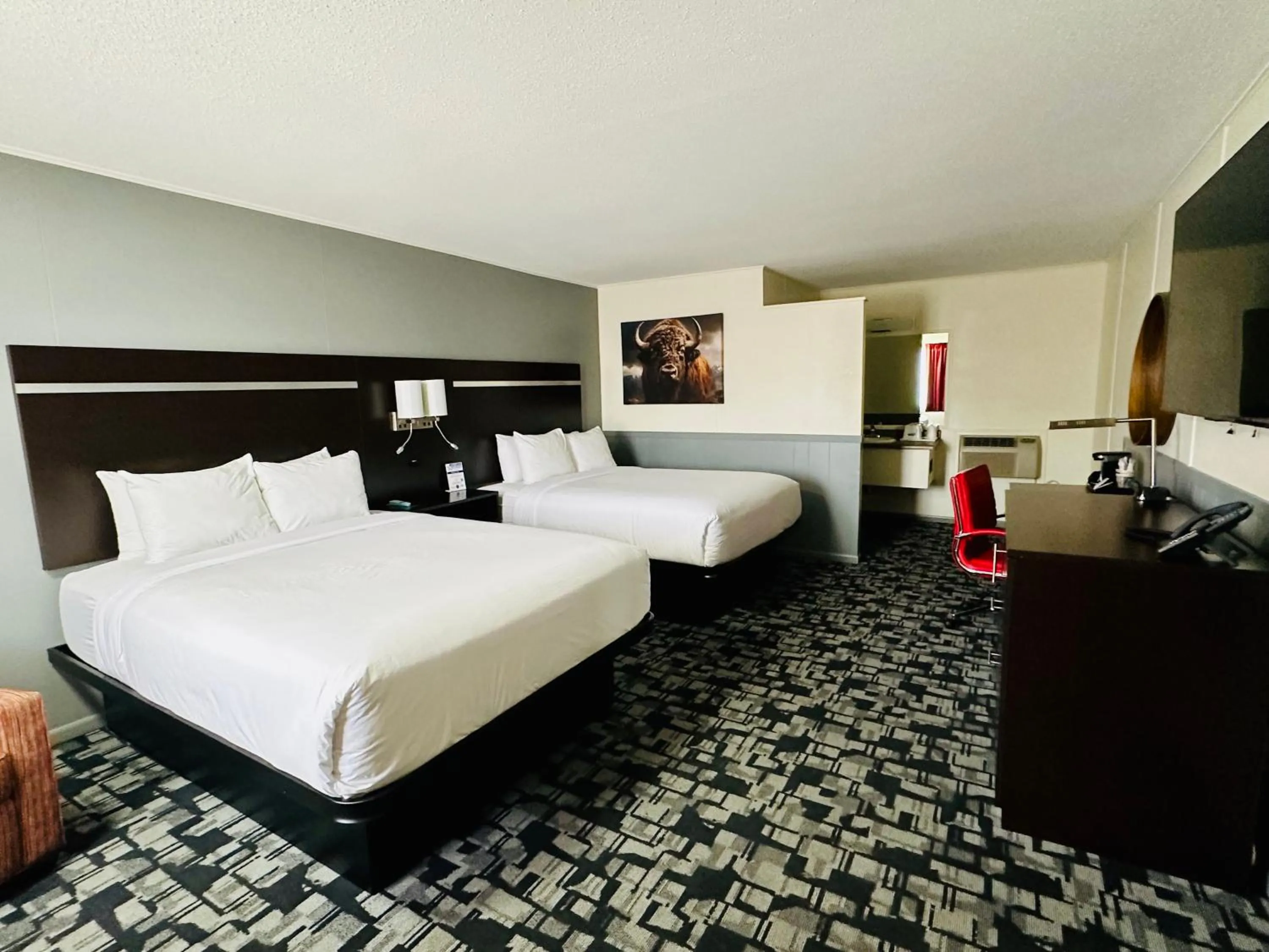 Bed in Americas Best Value Inn Wall