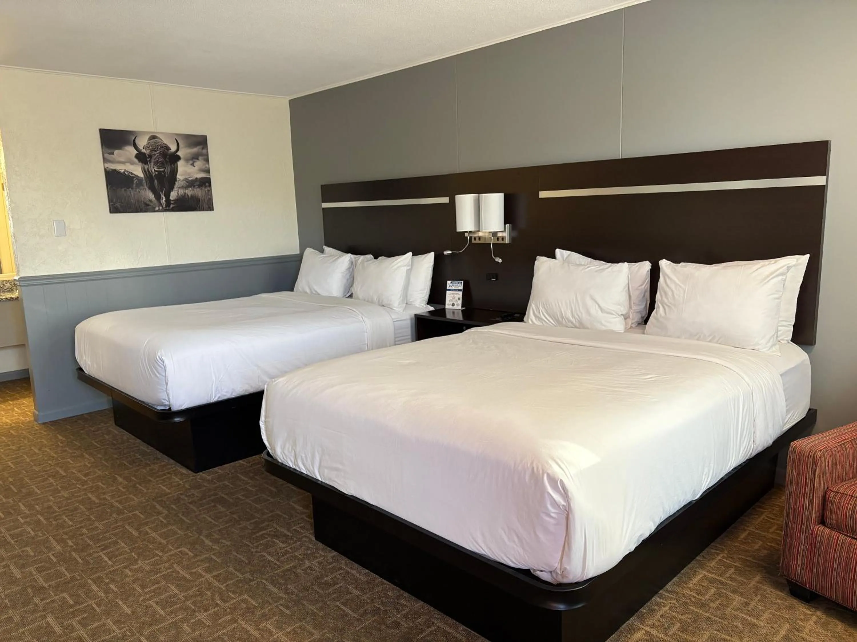 Bed in Americas Best Value Inn Wall