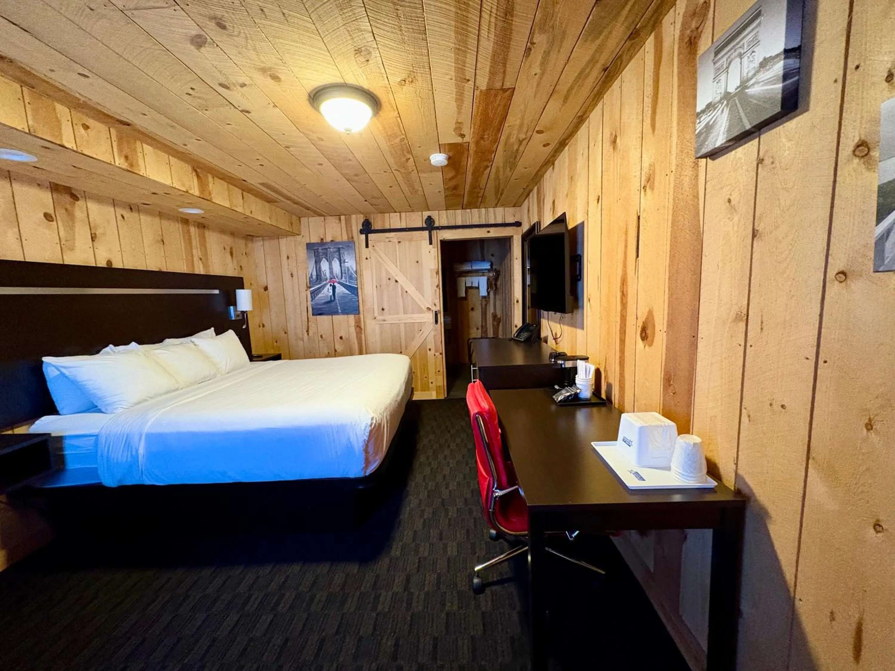 Bed in Americas Best Value Inn Wall